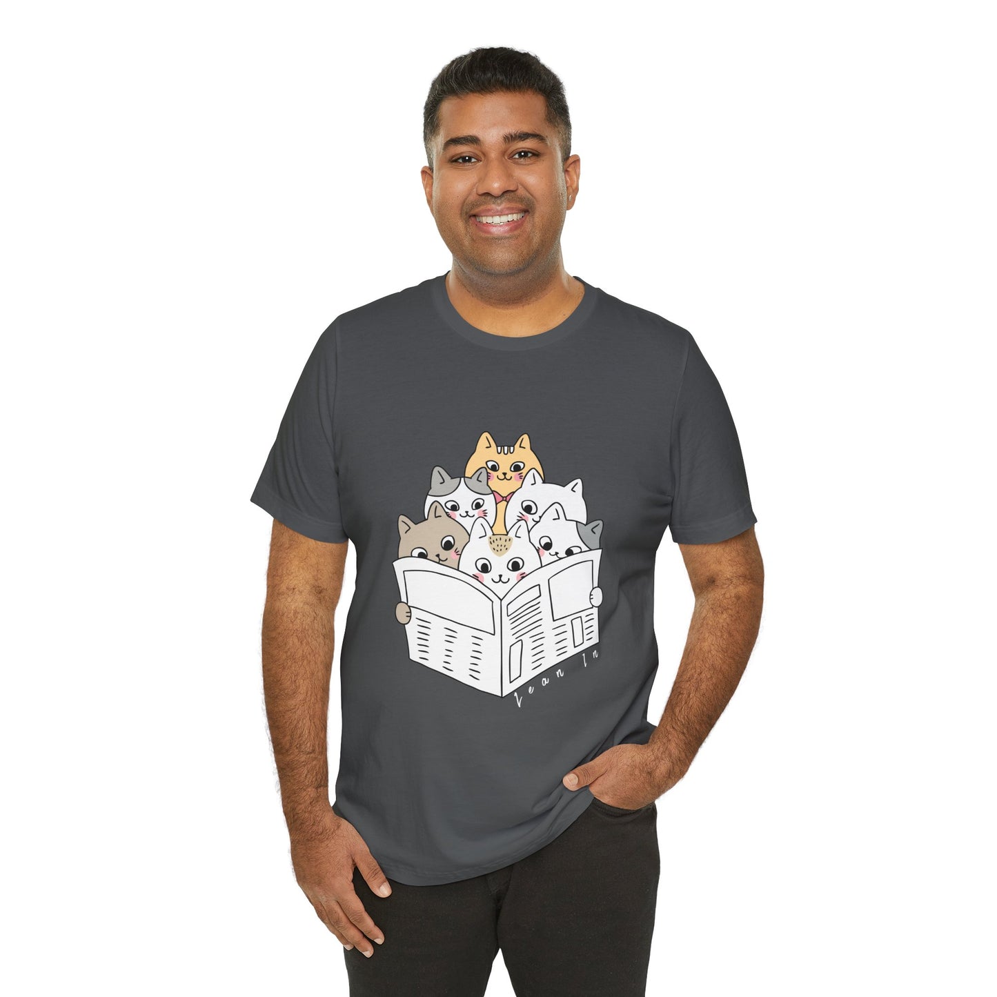 Man wearing a gray t-shirt with cartoon cats squeezed in to read the newspaper and text 'Lean In'