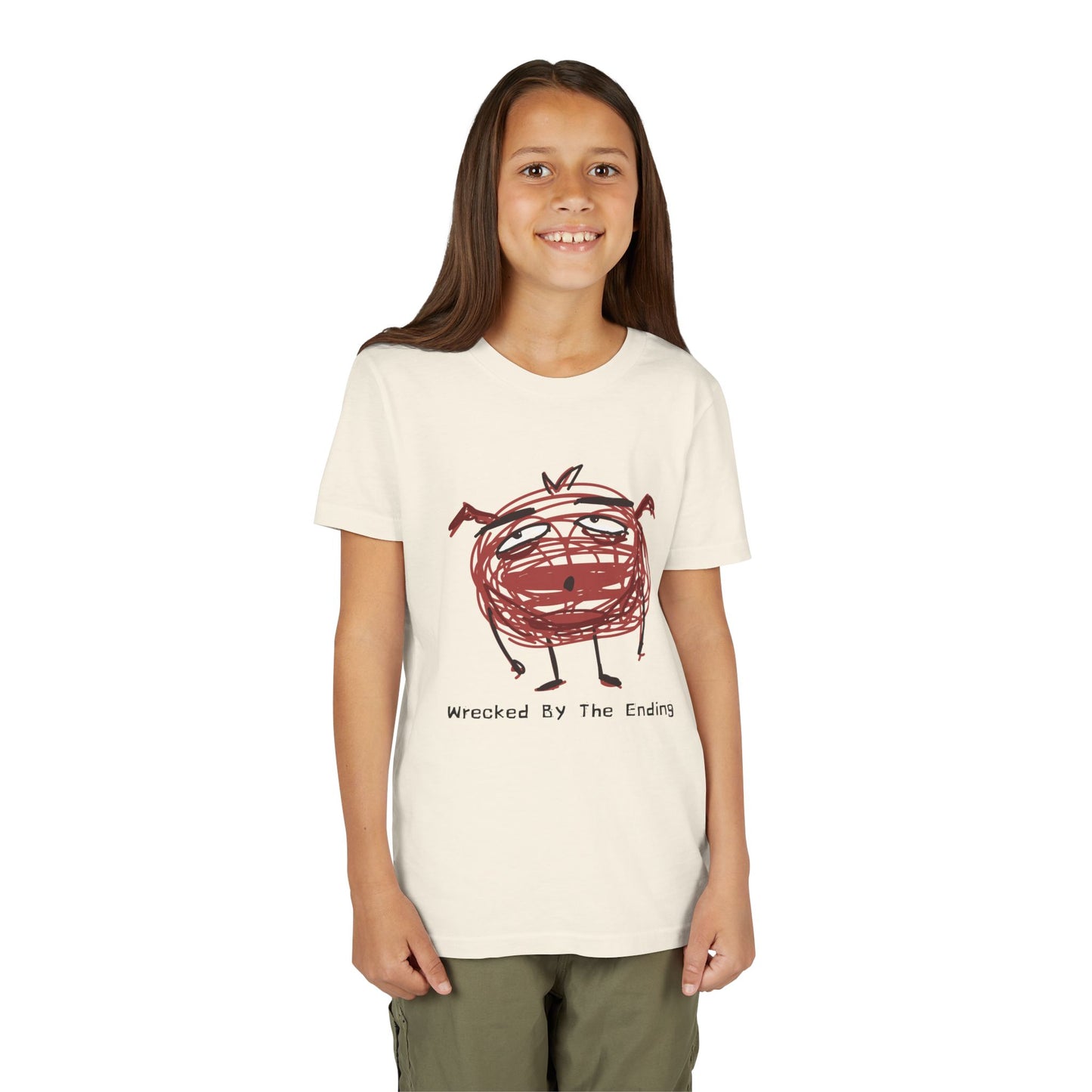 Girl wearing a beige t-shirt with a red scribbled character and text 'wrecked by the ending'