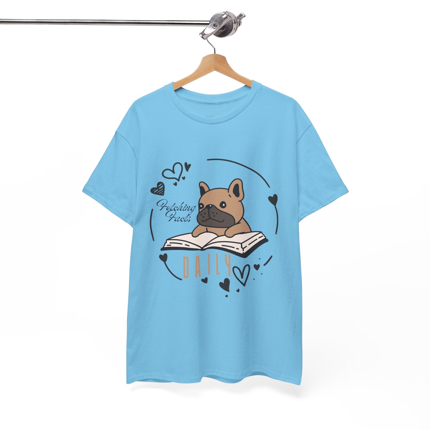 Light blue t-shirt with a dog graphic reading a book and text 'Fetching Facts Daily, circled with hearts 
