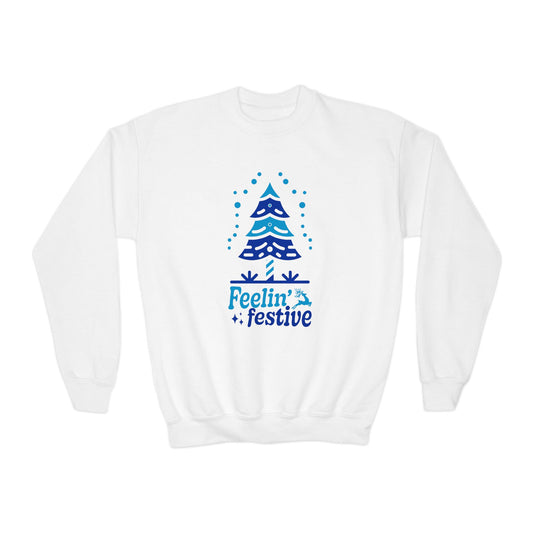 White sweatshirt with blue Christmas tree design and 'Feelin' festive' text on a white background