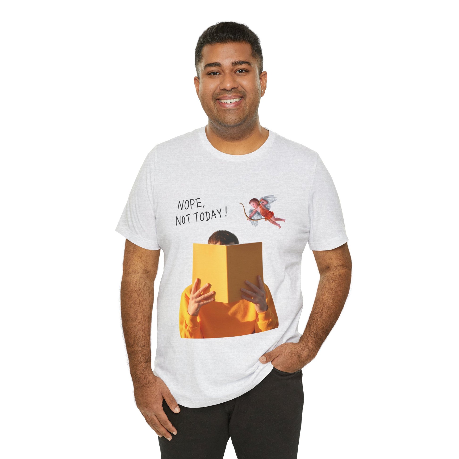 Man wearing an ash t-shirt with graphic design of person holding a book in front of their face while cupid is hovering above and text 'NOPE, NOT TODAY!' 