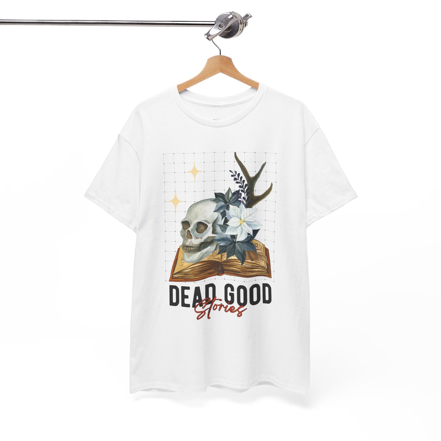 White t-shirt with skull, antler, and flower on a book with text 'Dead Good Stories' on a hanger against a white background
