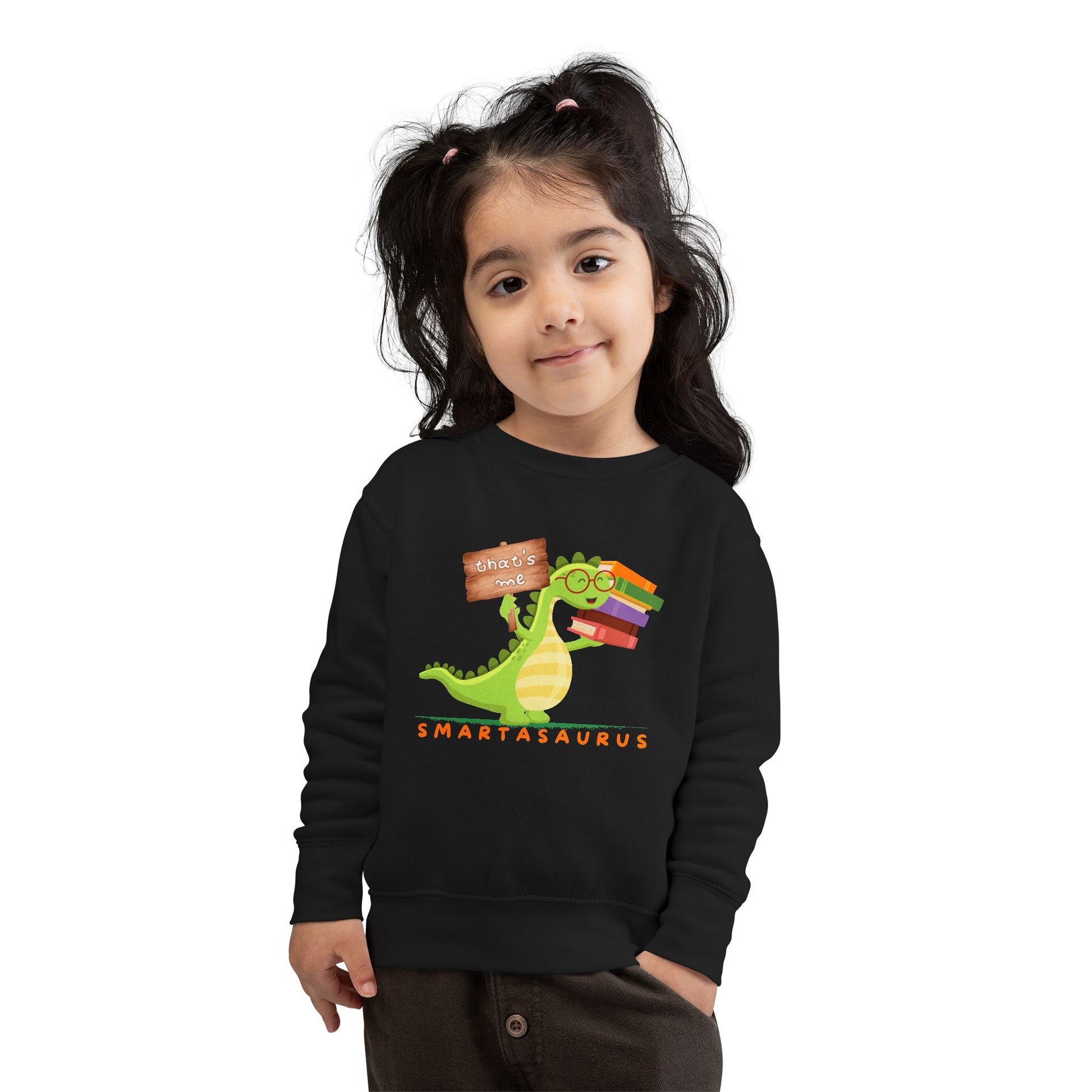 Girl wearing a black toddler sweatshirt with a smart book loving dinosaur and text 'Smartasaurus'