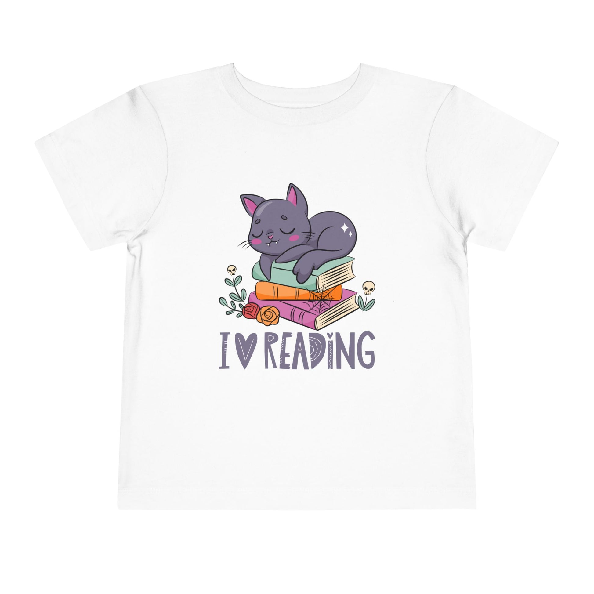 White toddler t-shirt with a gray cat sleeping on some books, surrounded by flowers and 'I love reading' text 