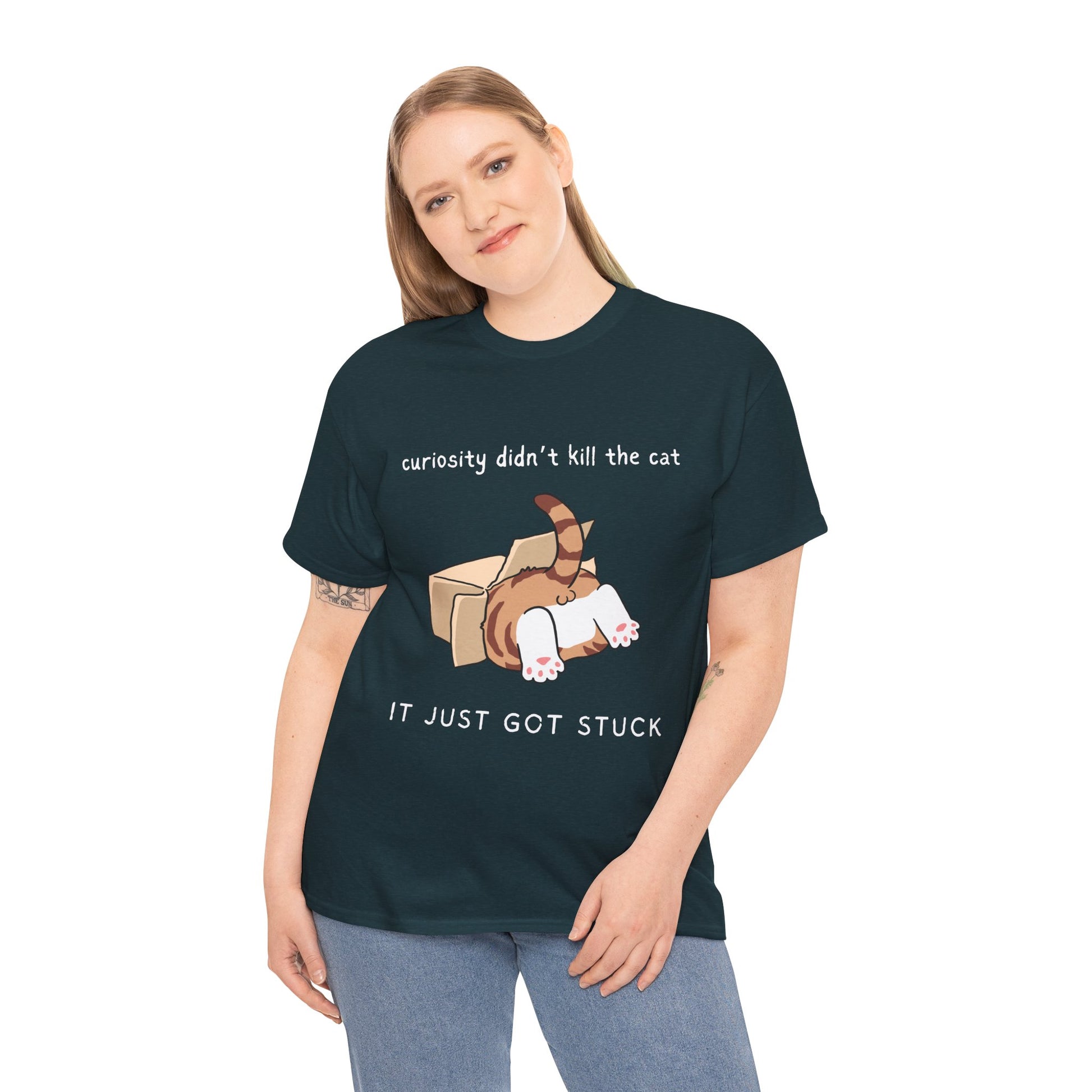 Woman wearing a dark t-shirt with a cat 's back end sticking out of a box and text 'curiosity didn't kill the cat, it just got stuck'
