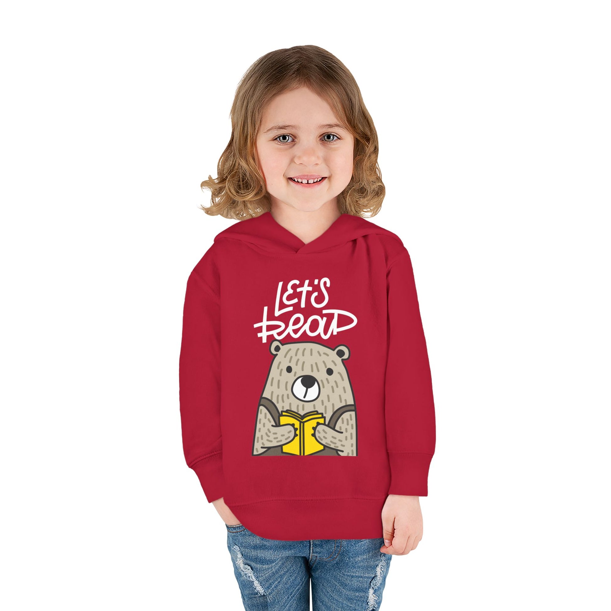 Girl wearing a red toddler hoodie with bear graphic reading a book and 'Let's Read' text 