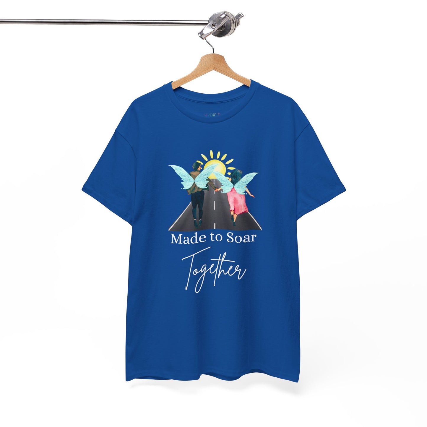 Blue t-shirt with graphic design of two fairies running down the toward toward the sunset and text 'Made To Soar Together' and text 'Made to Soar Together' 