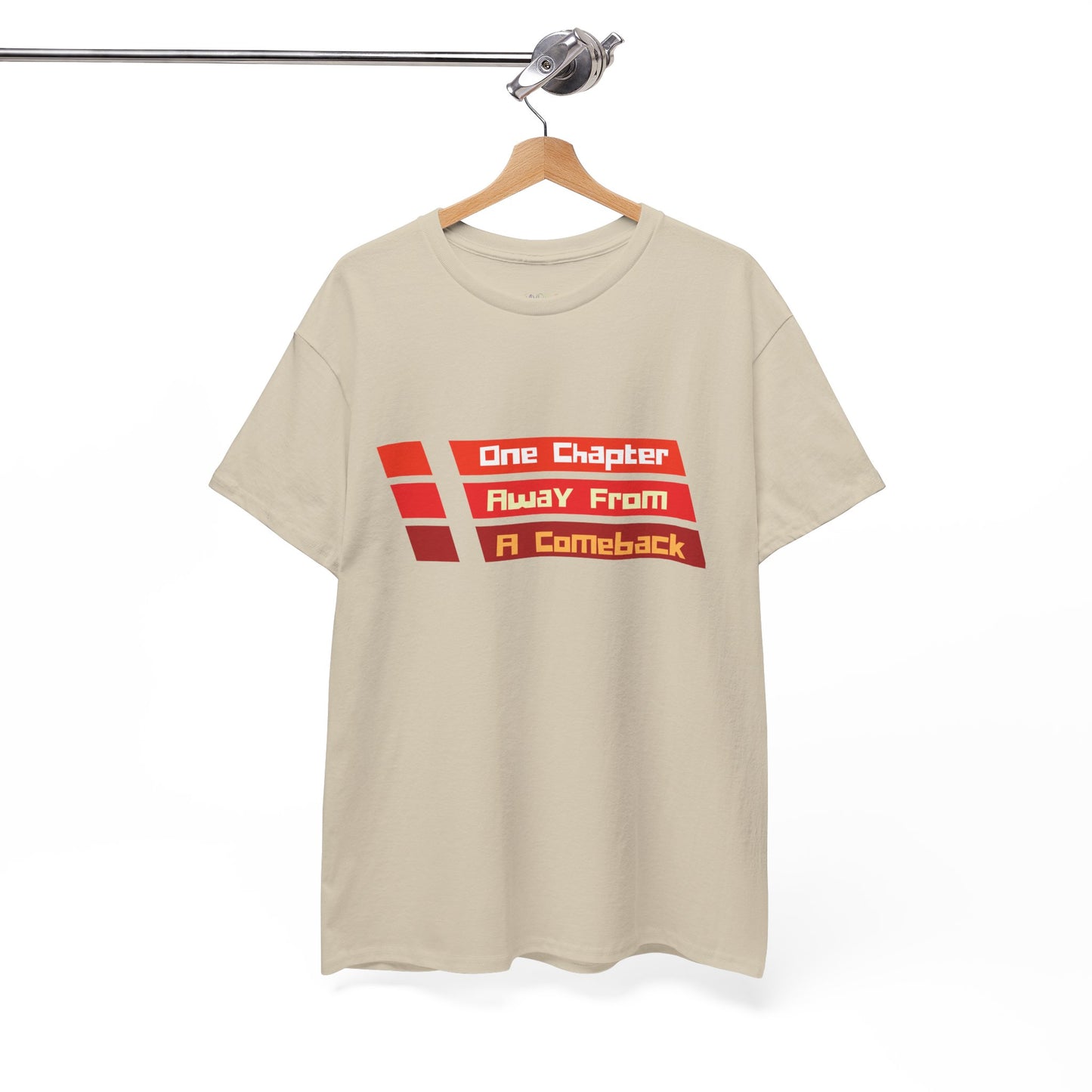 Tan t-shirt with red lines and text in each 'One Chapter Away From A Comeback'