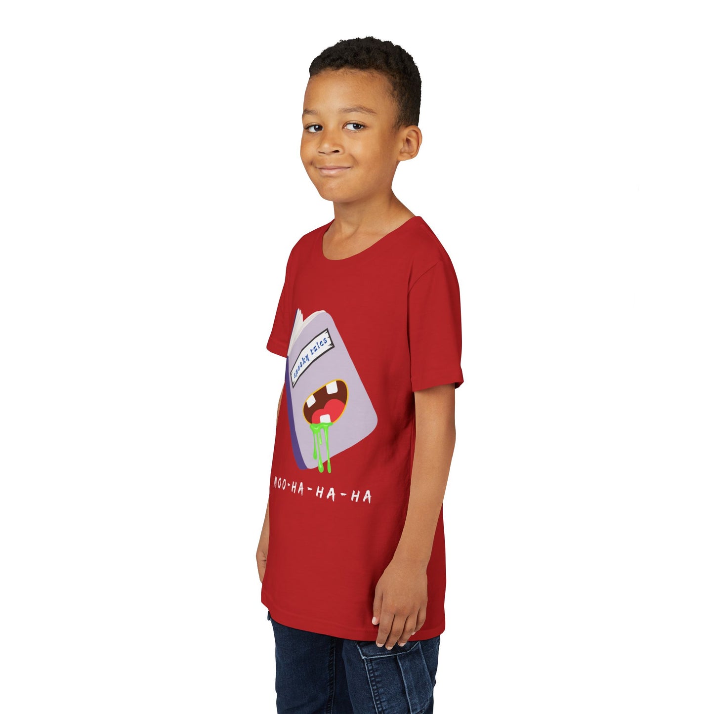 Boy wearing a red t-shirt with a graphic design of a book titled 'Spooky Tales' and a green drooling mouth on the cover, text 'Moo-Ha-Ha-Ha' at the bottom