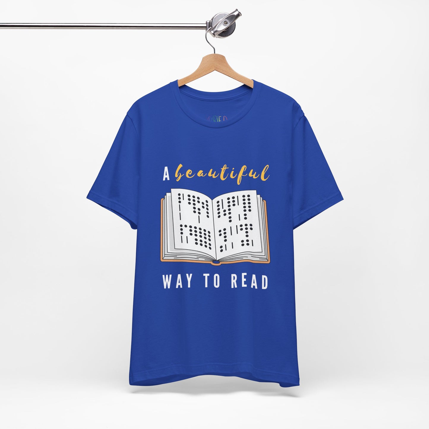 Blue t-shirt with graphic design of a book in braille and text 'A Beautiful Way to Read'