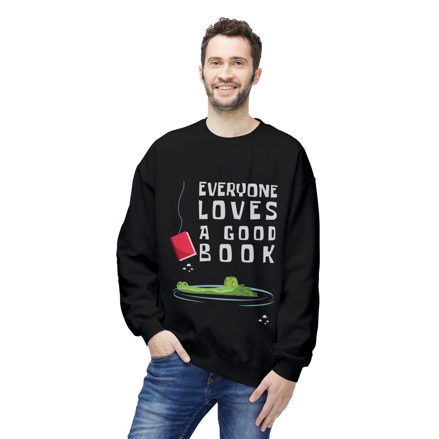 Man wearing a black sweatshirt with a book on a fishing hook, dangling in front of an alligator and text 'Everyone Loves a Good Book' 