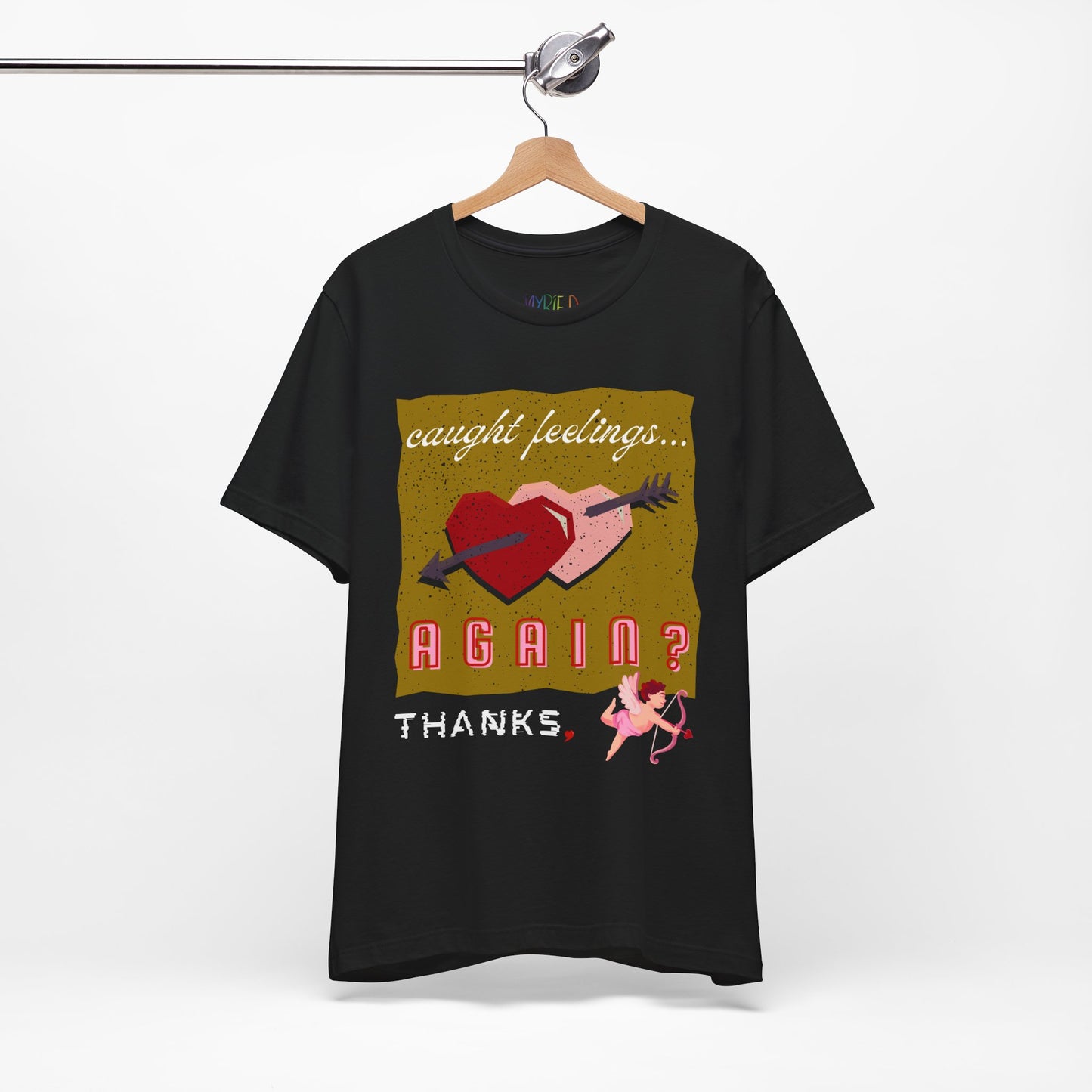 Black t-shirt with double heart graphic design and text 'Caught Feelings AGAIN? Thanks,' followed by a picture of cupid