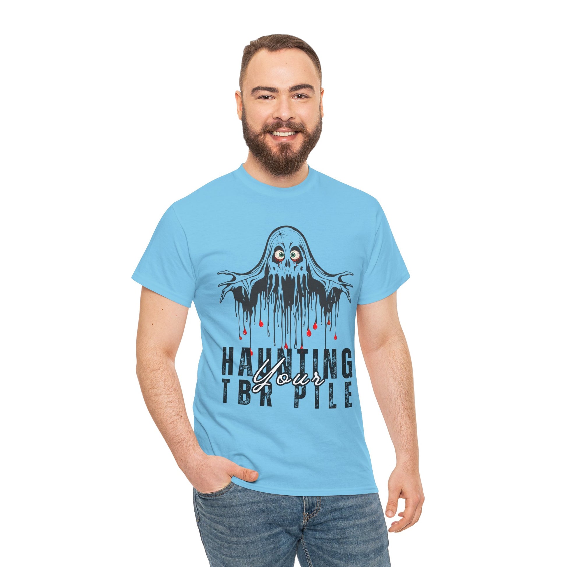 Man wearing a light blue t-shirt with ghost graphic and text 'Haunting Your TBR Pile' on a hanger against a white background