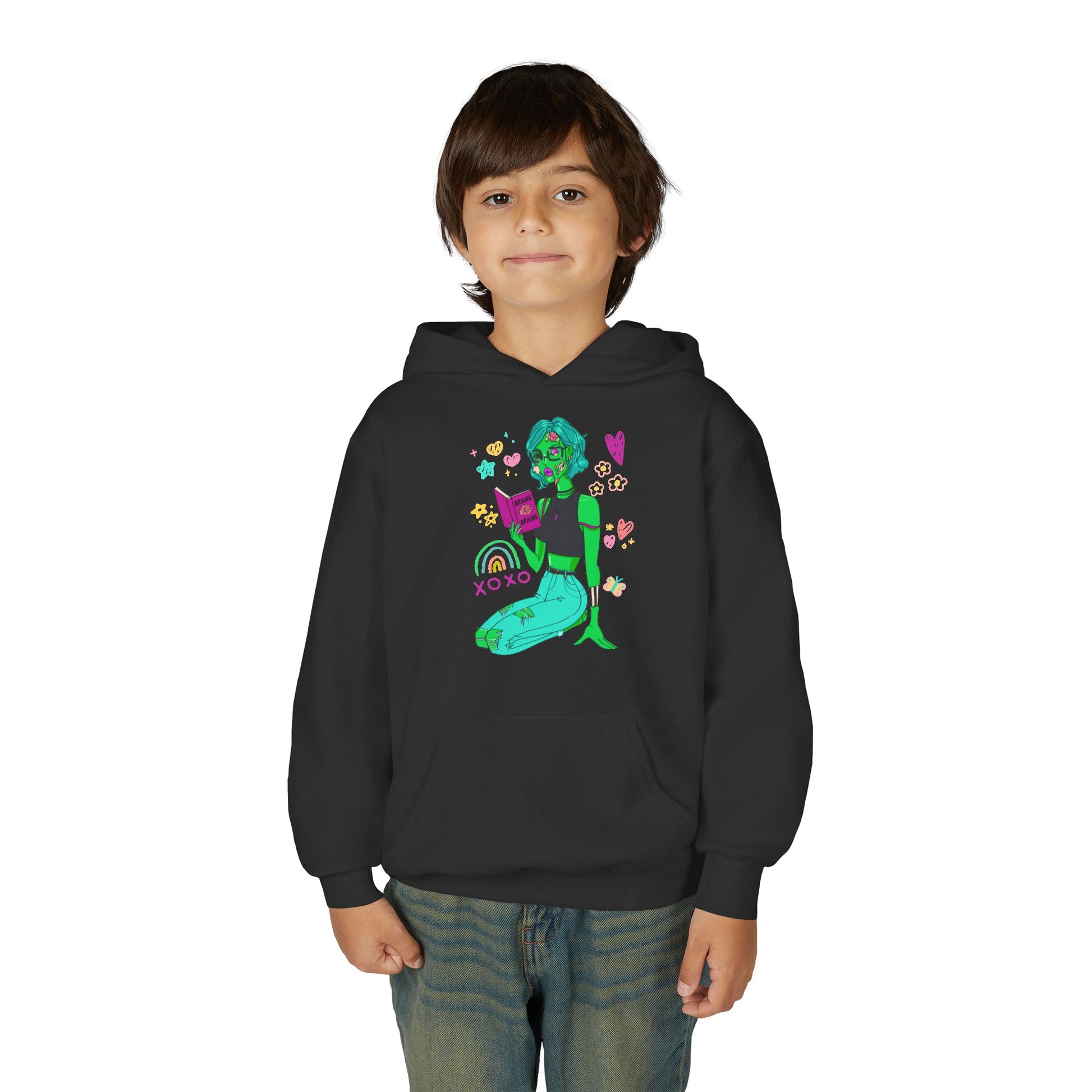 Boy wearing a black hoodie with a colorful reading zombie surrounded by doodles
