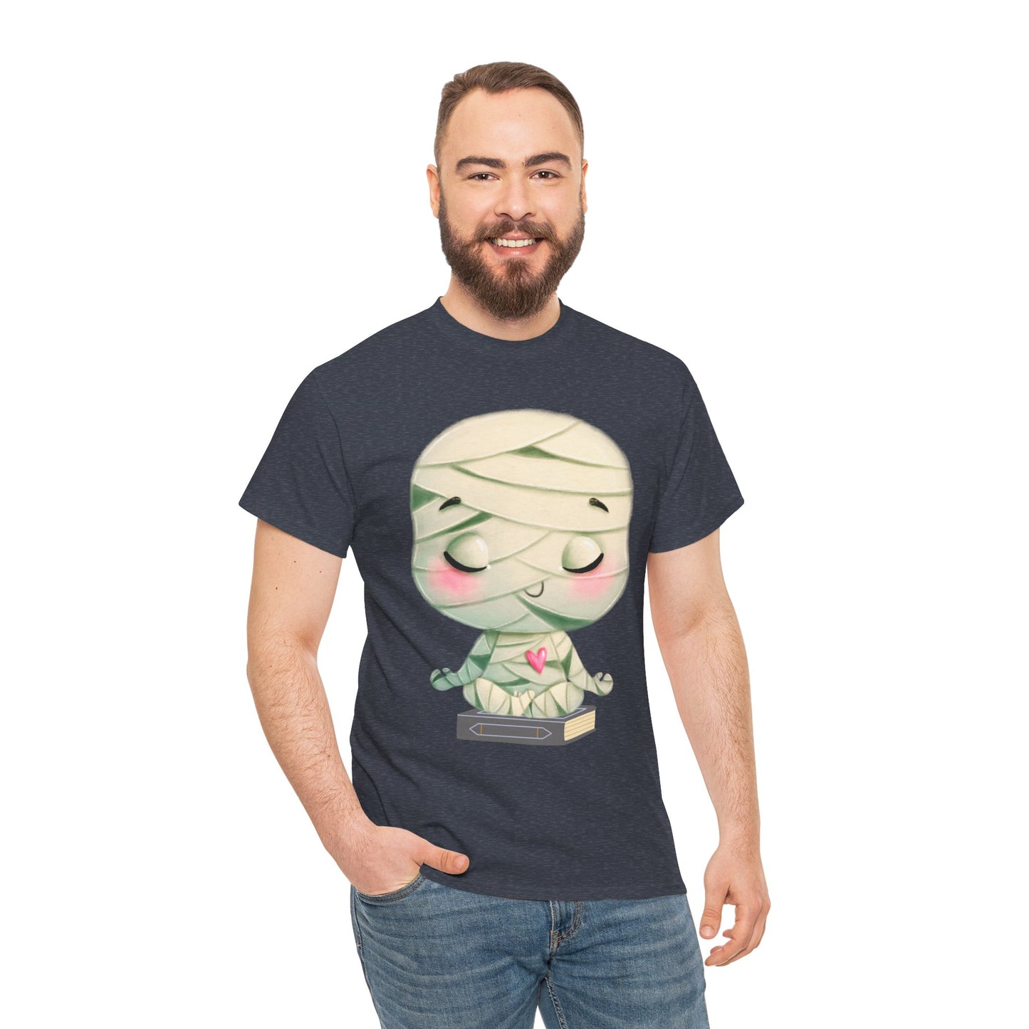 Man wearing a heather navy t-shirt with a cartoon mummy in a meditation pose, sitting on a book