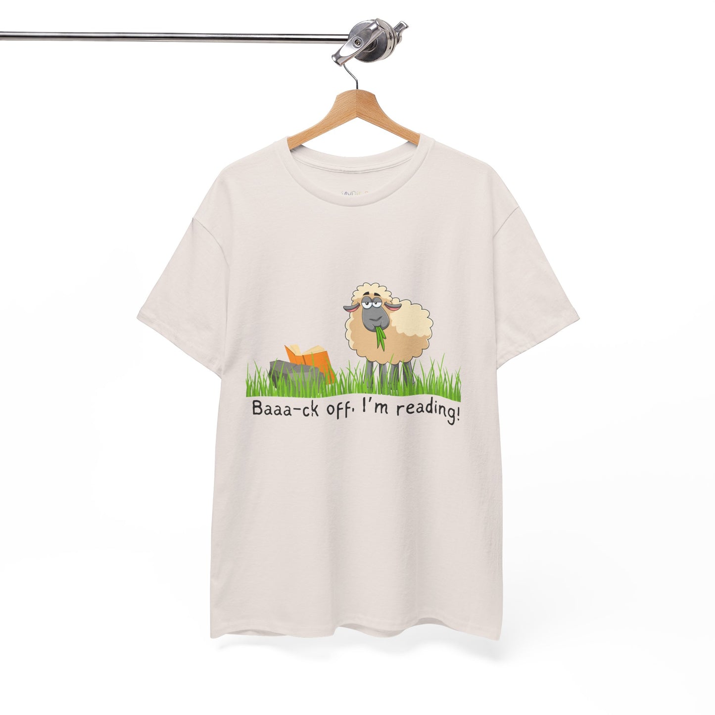 Ice gray t-shirt with a sheep munching grass and reading a book propped up on a rock, text 'Baaa-ck off. I'm Reading!'