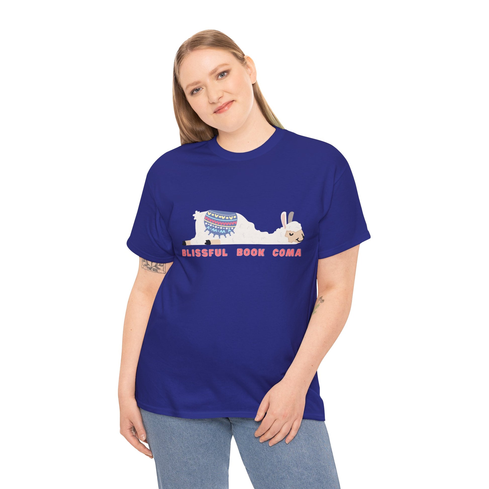 Woman wearing a blue t-shirt with a napping llama and text 'Blissful Book Coma' 