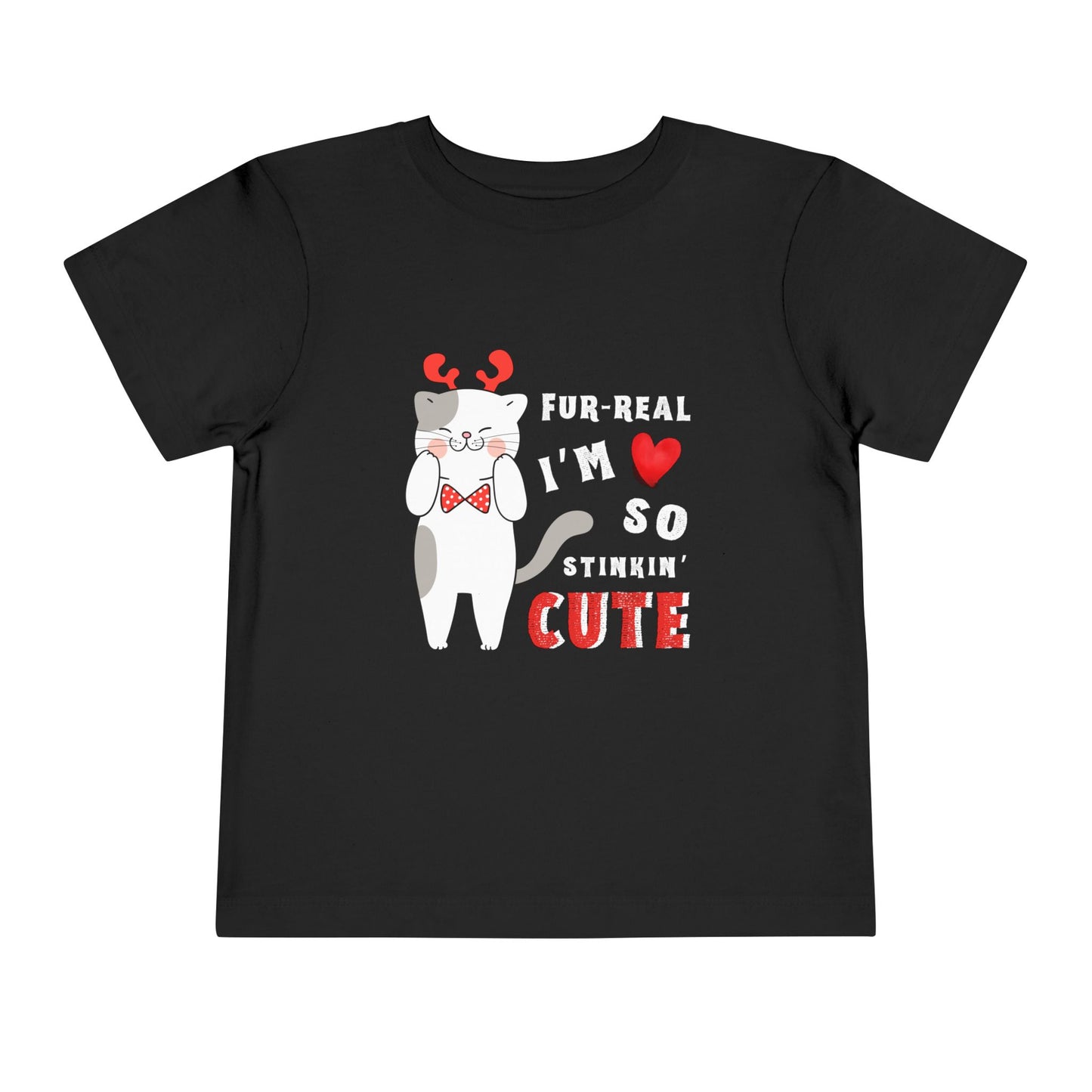 Black toddler t-shirt with a cartoon cat design in reindeer antlers and bow tie, with text 'FUR-REAL I'M SO STINKIN' CUTE' on a white background