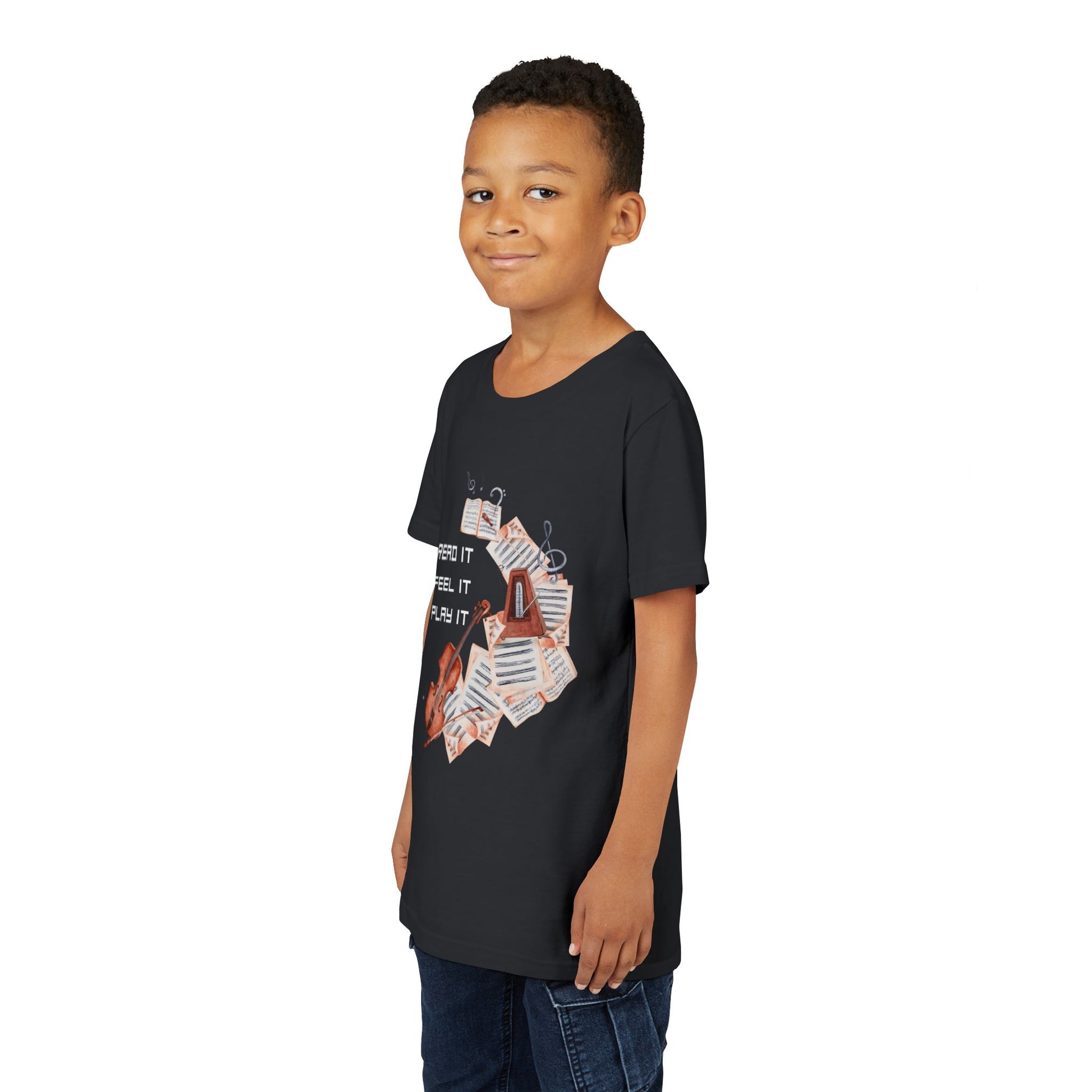 Boy wearing a black t-shirt with swirling music sheets, metronome, violin and text 'Read It. Feel It. Play It.'