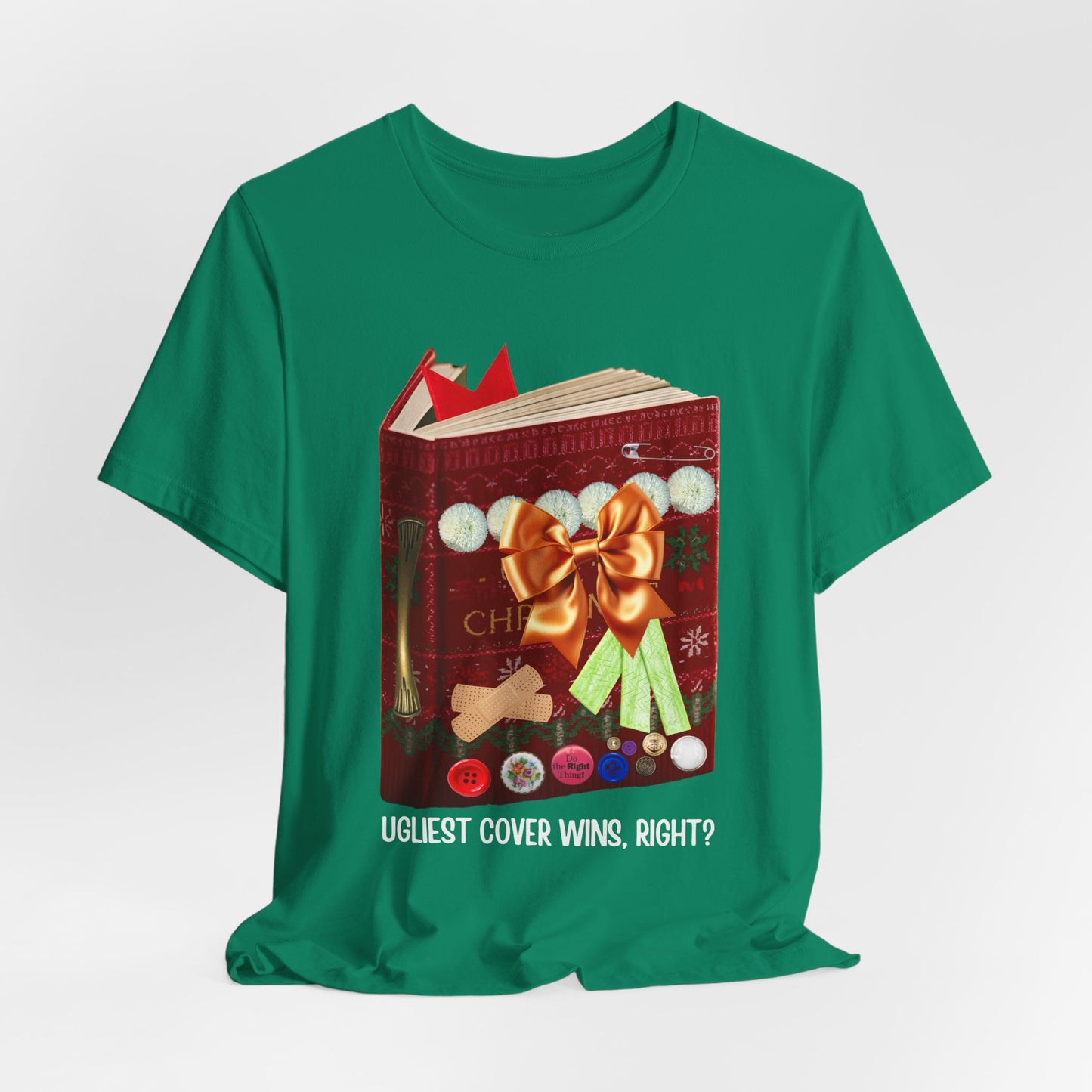 Green t-shirt a book decorated like an ugly Christmas sweater, full of buttons, bandaids, ribbon, etc. 