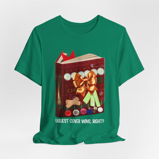 Green t-shirt a book decorated like an ugly Christmas sweater, full of buttons, bandaids, ribbon, etc. 