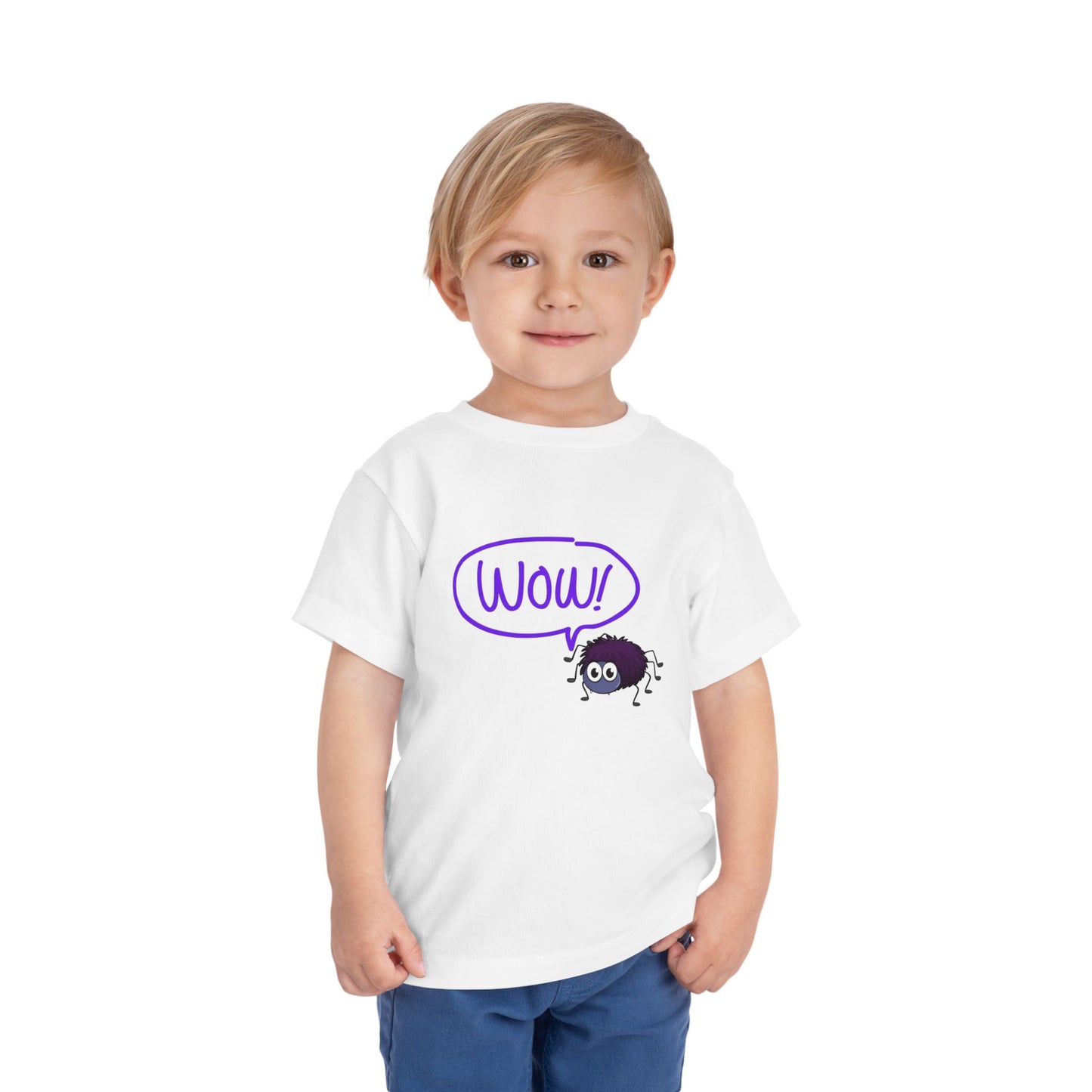 Toddler wearing a white t-shirt with a purple spider and a 'WOW!' thought bubble