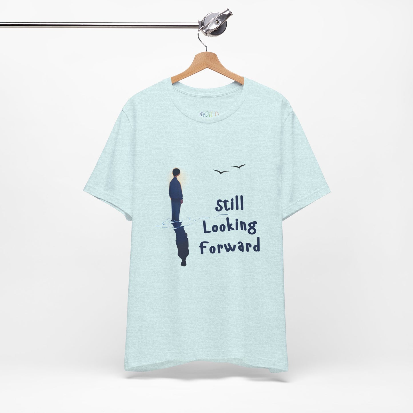 Light ice blue t-shirt with graphic of a person standing in the water with his reflection and text 'Still Looking Forward' 