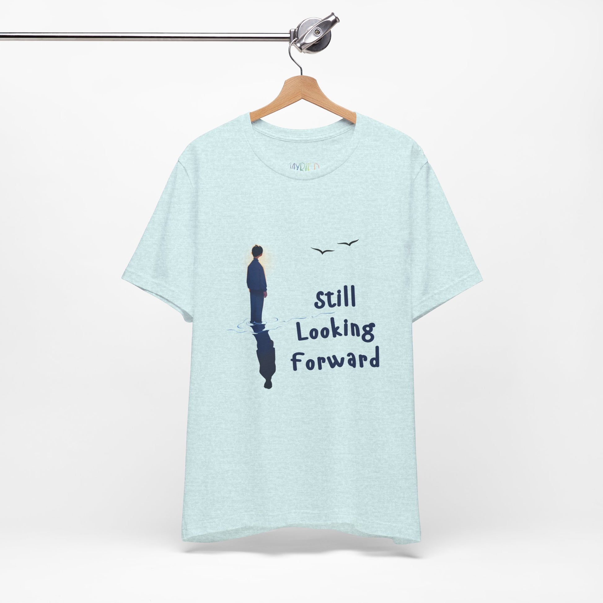 Light ice blue t-shirt with graphic of a person standing in the water with his reflection and text 'Still Looking Forward' 