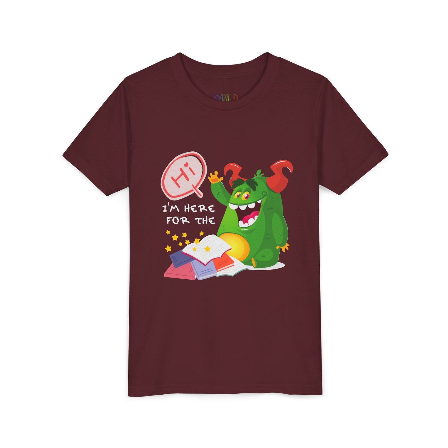 Maroon t-shirt with a chubby green monster waiving, with text 'Hi, I'm Here For The' above a messy stack of books