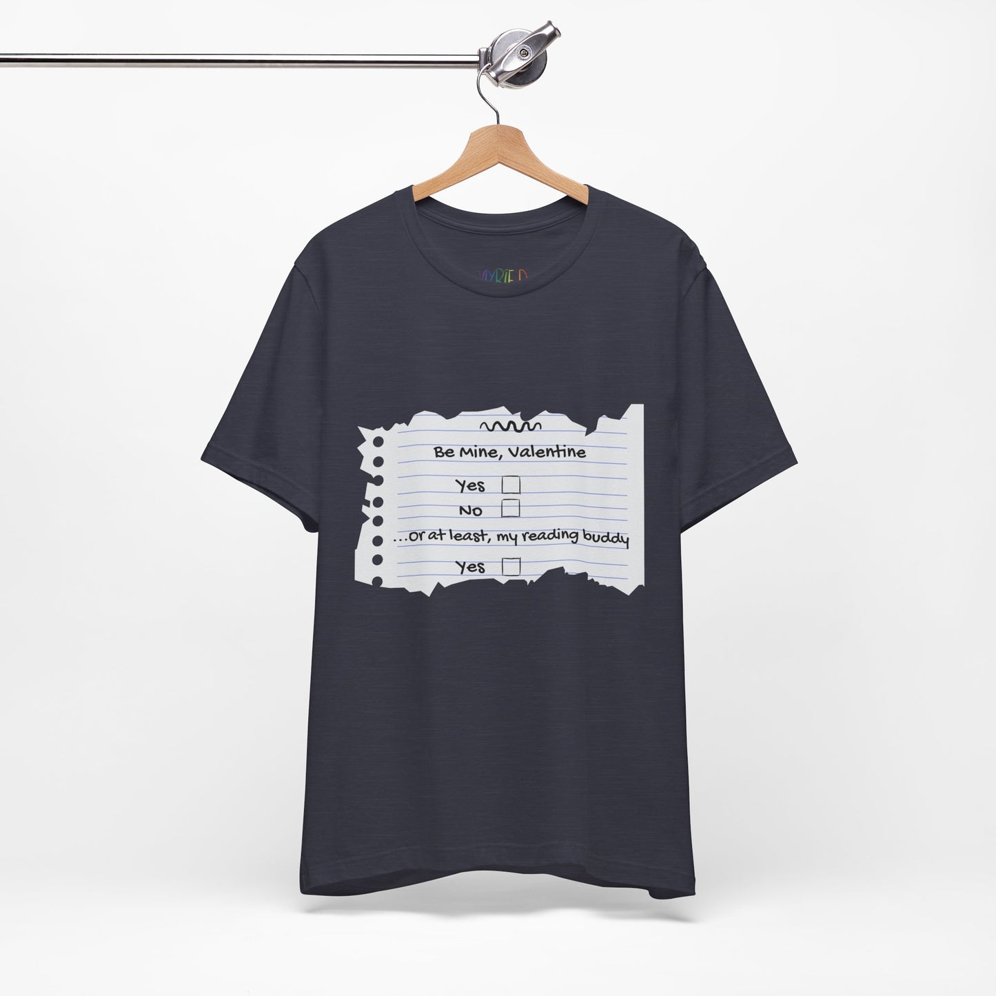 Navy blue t-shirt with an image of torn notebook paper and old school checkboxes depicting 'Be Mine Valentine, Yes, No' and 'Or At Least , My Reading Buddy, Yes'