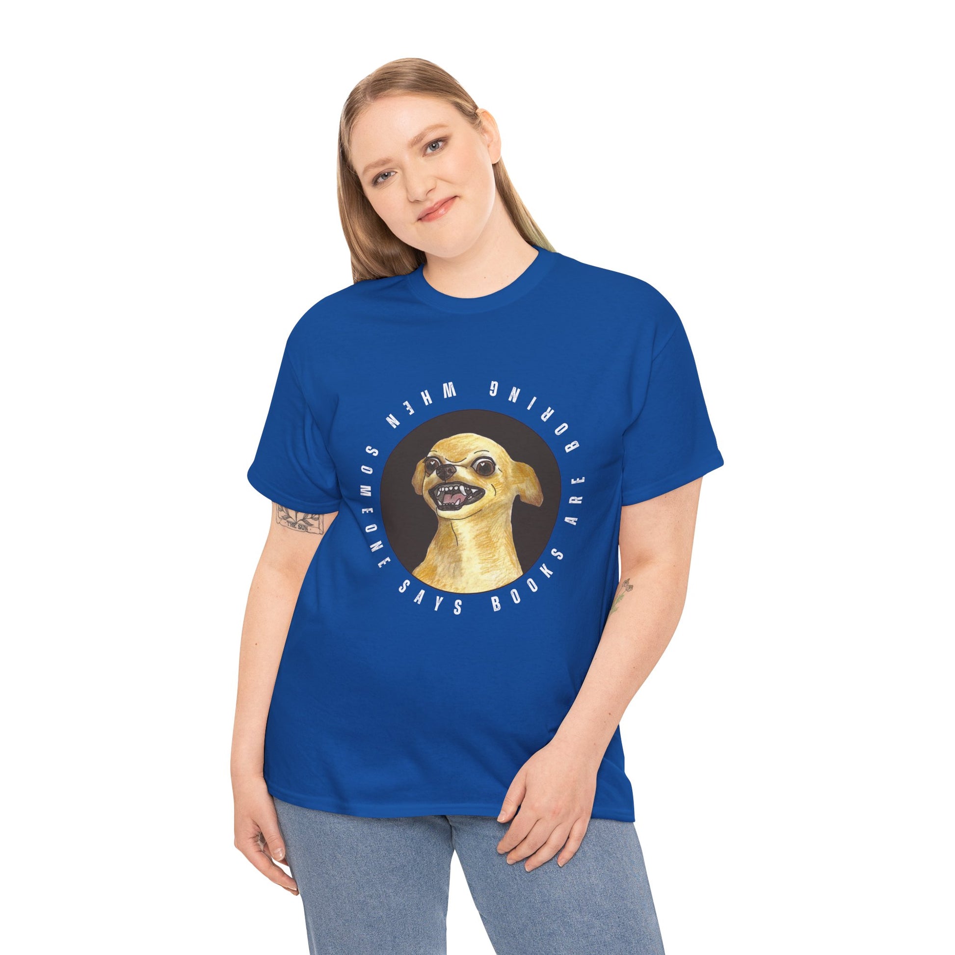 Woman wearing a blue t-shirt with a graphic of a fierce chihuahua dog, circled by text 'When Someone Says Books Are Boring'