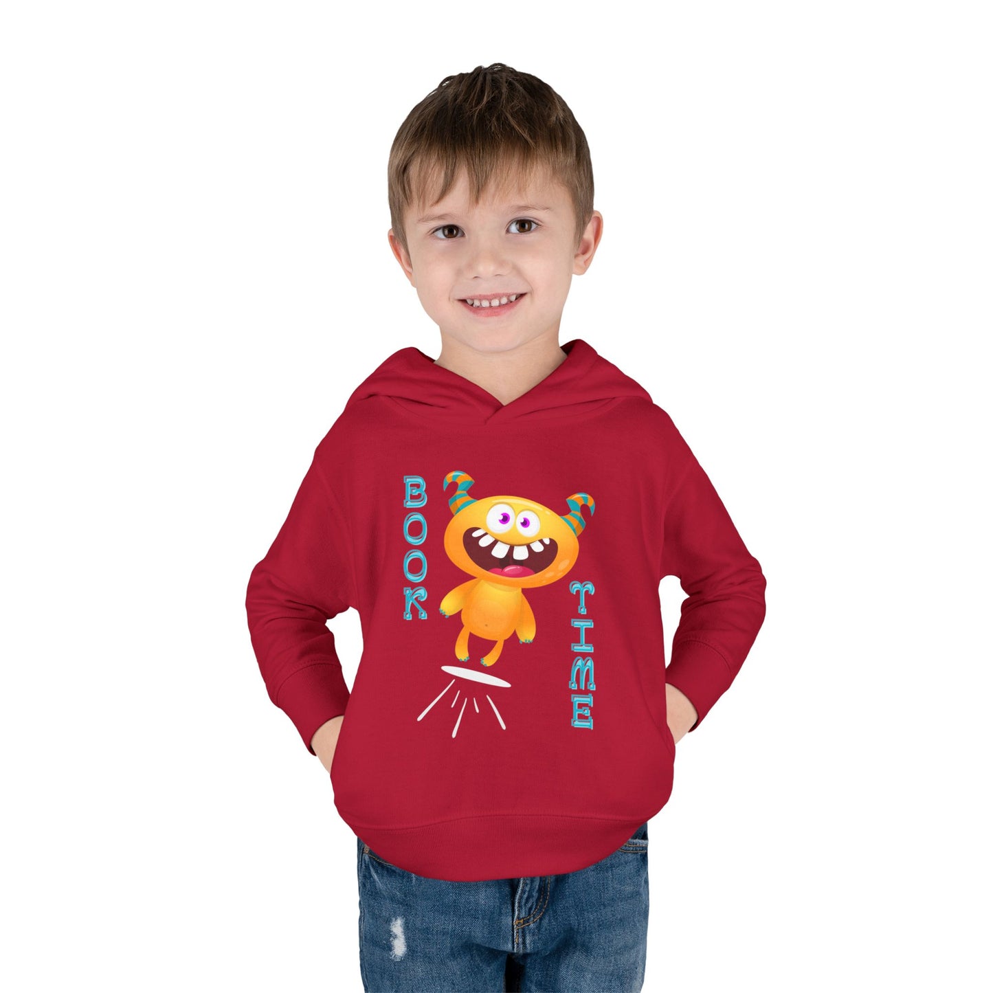 Boy wearing a red toddler hoodie with a cartoon monster jumping and text 'BOOK TIME'