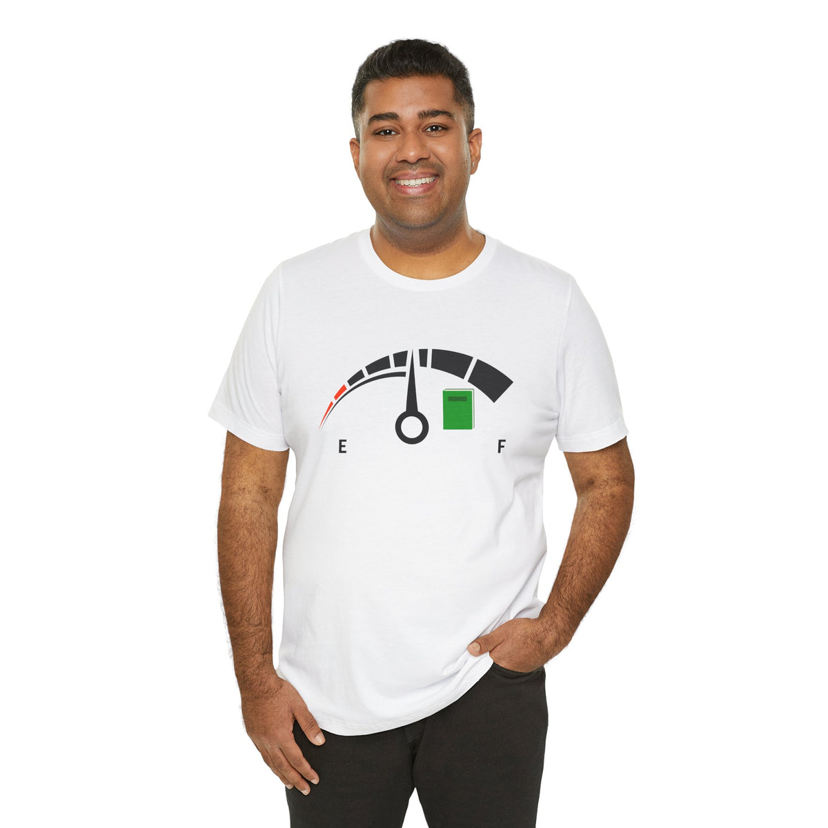 Man wearing a white t-shirt of a fuel gage ranging from empty to full with a book near the full.