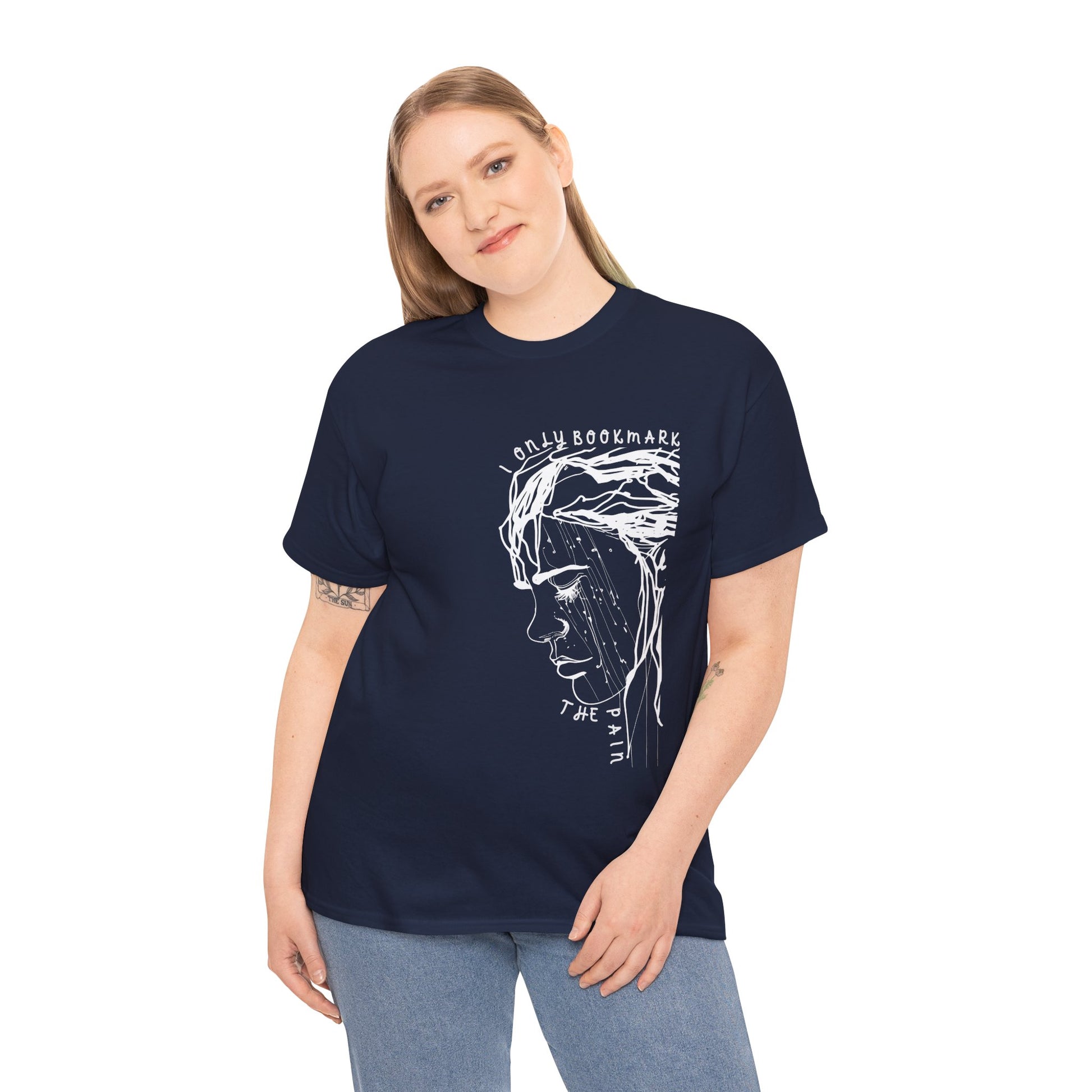 Woman wearing a navy blue t-shirt with an off-center white sketched sad person and text 'I Only Bookmark The Pain'