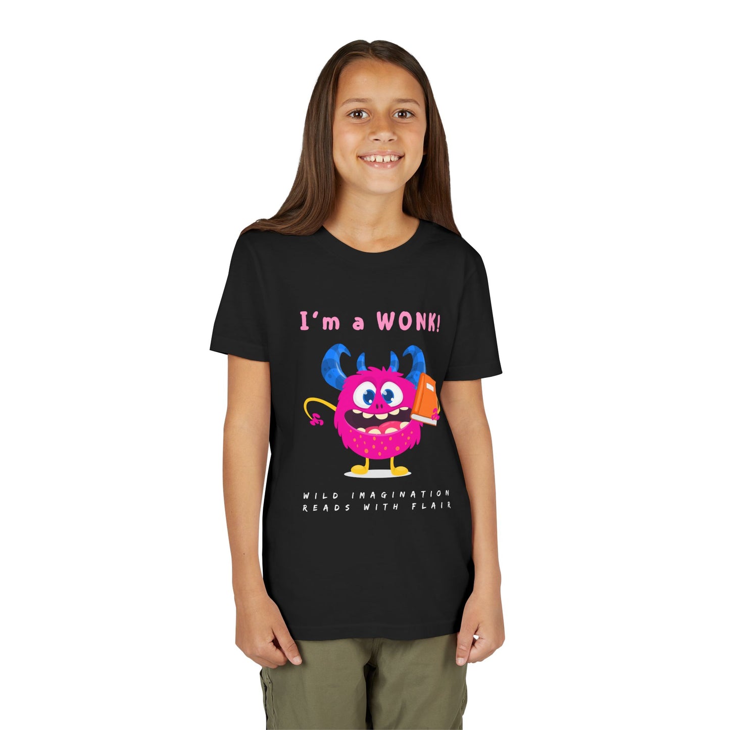 Girl wearing a black personality t-shirt with a colorful pink monster graphic holding a book and proudly stating 'I'm a WONK!'