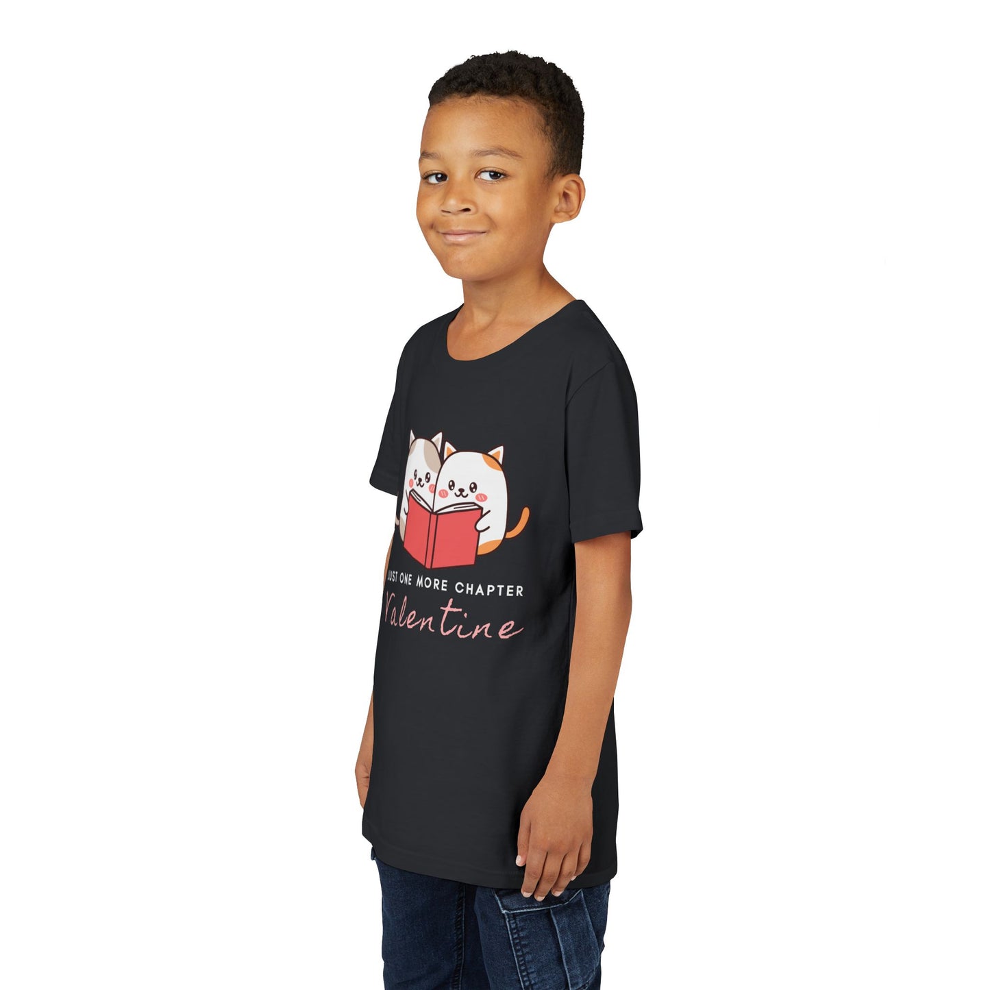 Boy wearing a black t-shirt with two cartoon cats reading a book and 'Just One More Chapter Valentine' text 