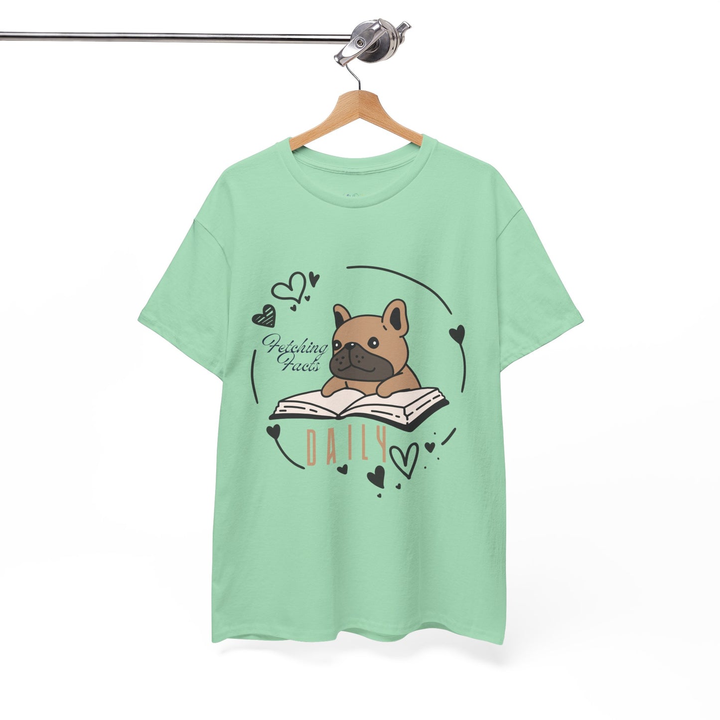 Light green t-shirt with a dog graphic reading a book and text 'Fetching Facts Daily, circled with hearts 