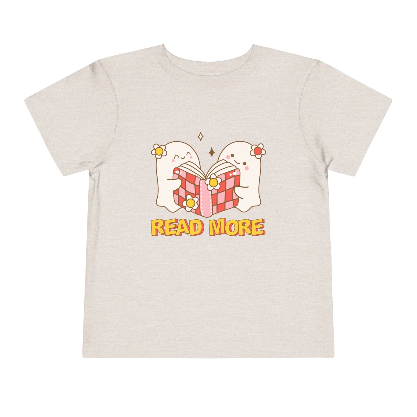 Beige t-shirt with cartoon ghosts reading a shared book and 'Read More' text 