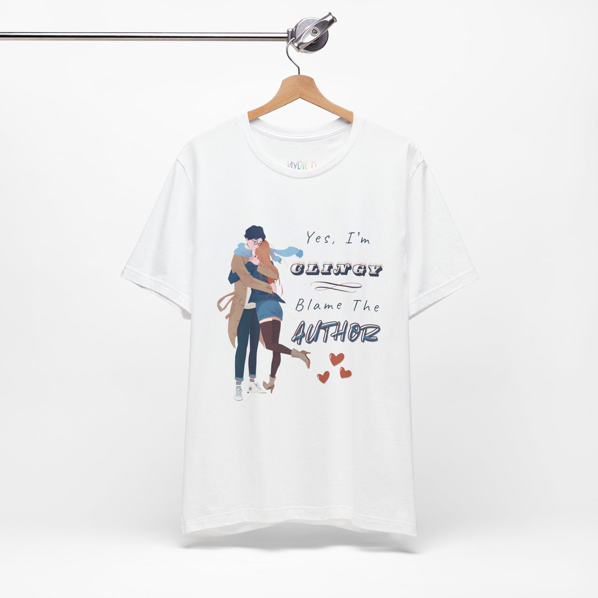 White t-shirt with graphic design of a woman snuggled up to a man and text " and text on a white background 'Yes, I'm CLINGY. Blame The Author.'
