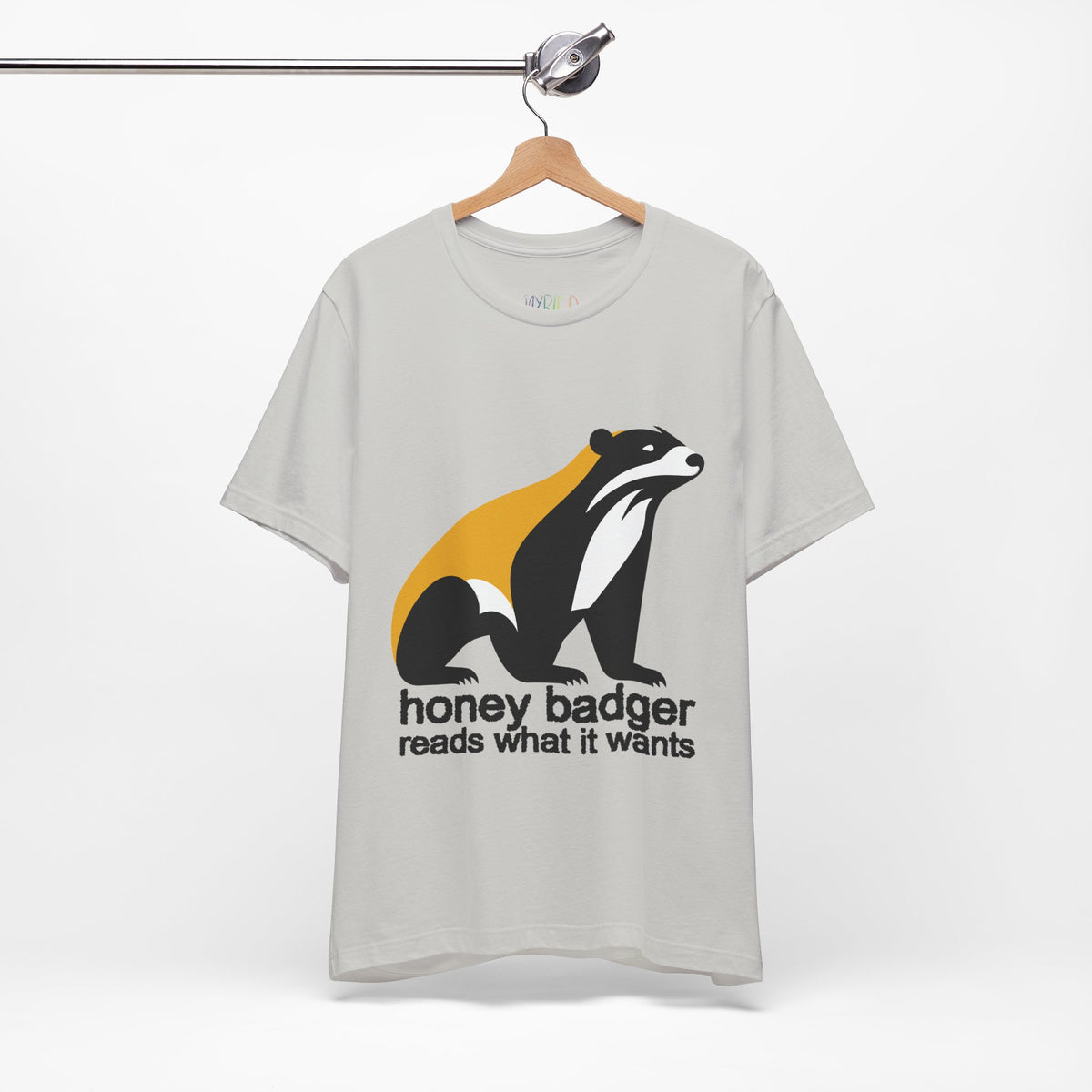 Gray t-shirt featuring a large black yellow and white badger with text "honey badger reads what it wants"