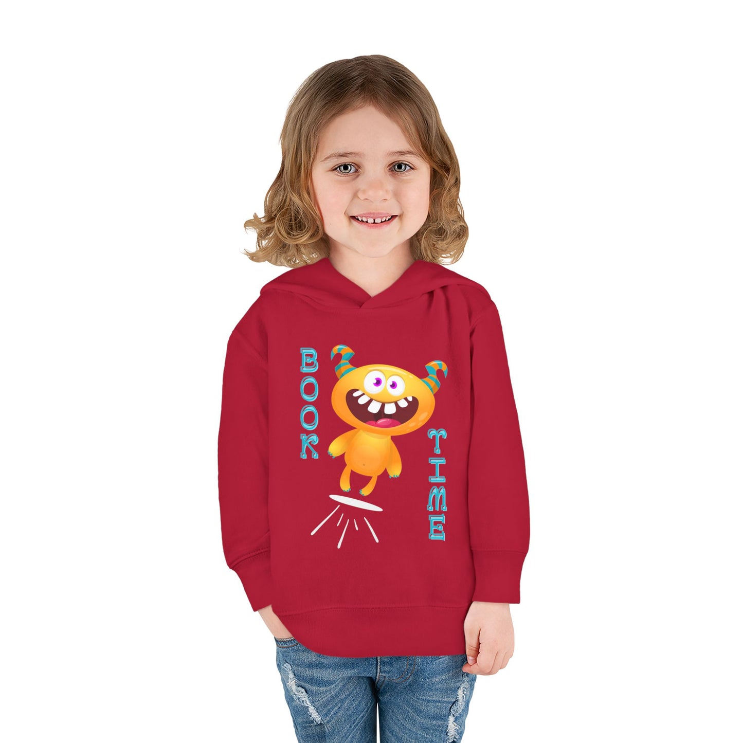 Girl wearing a red toddler hoodie with a cartoon monster jumping and text 'BOOK TIME'