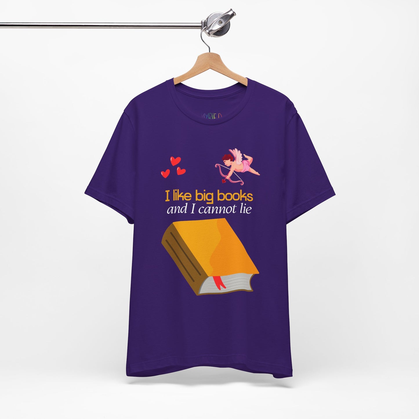Purple t-shirt with a cupid pointing an arrow at a large book and the words "I like big books and I cannot lie"