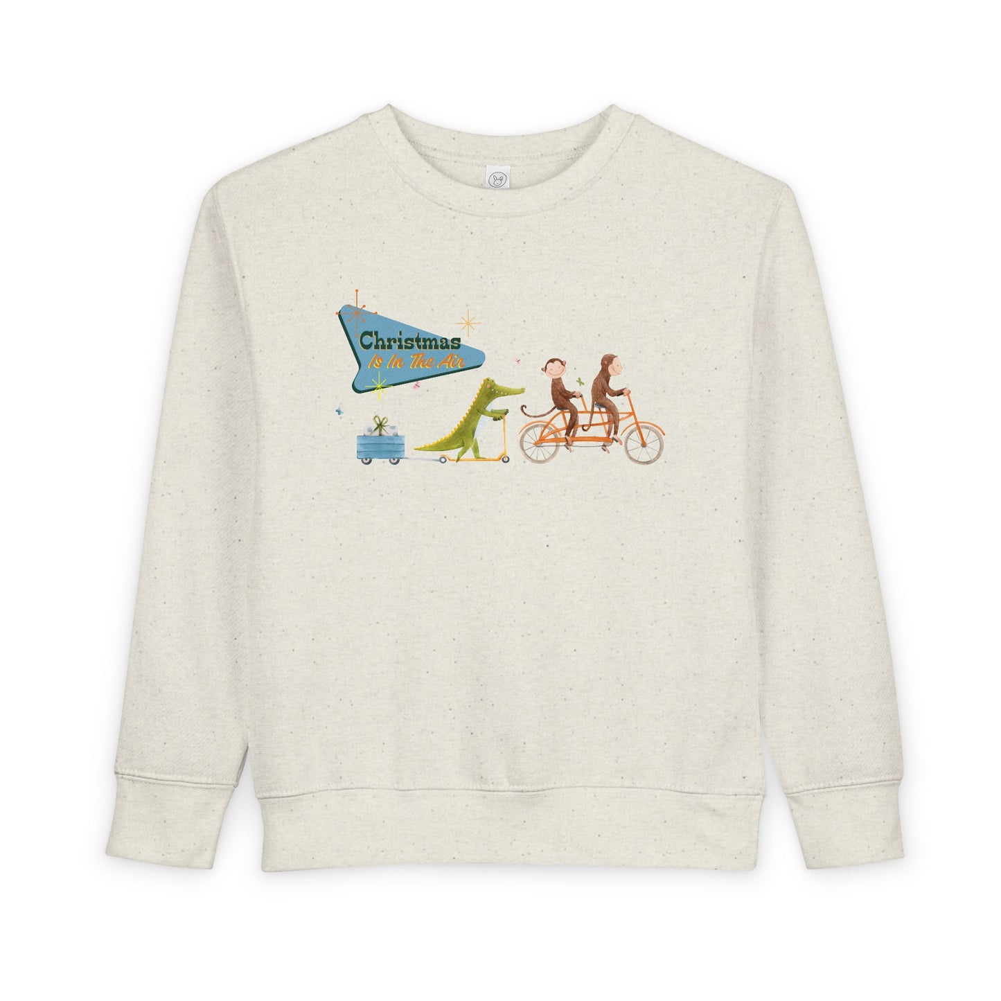 Beige toddler sweatshirt with a graphic design of two monkeys riding a tandem bike, followed by a crocodile on a scooter pulling a trailer with a present, text 'Christmas Is In The Air' 