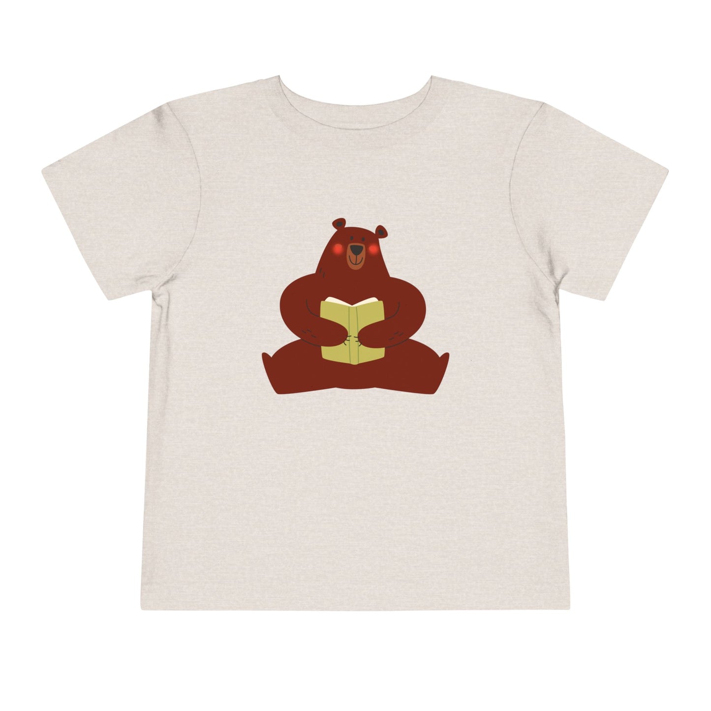 Sandy beige t-shirt with a blushing sear holding a book 