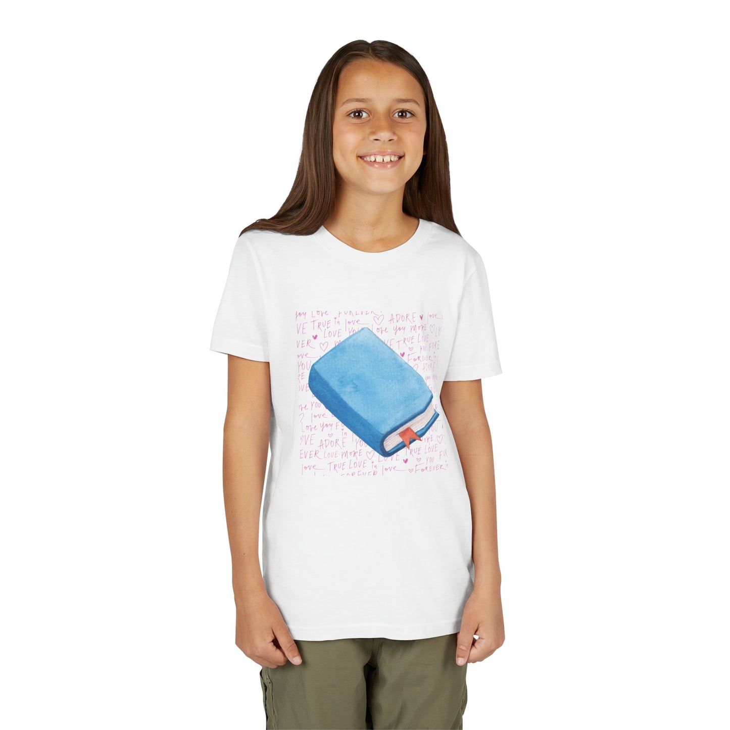 Girl wearing a white t-shirt with a pink hand writing and a blue book graphic 