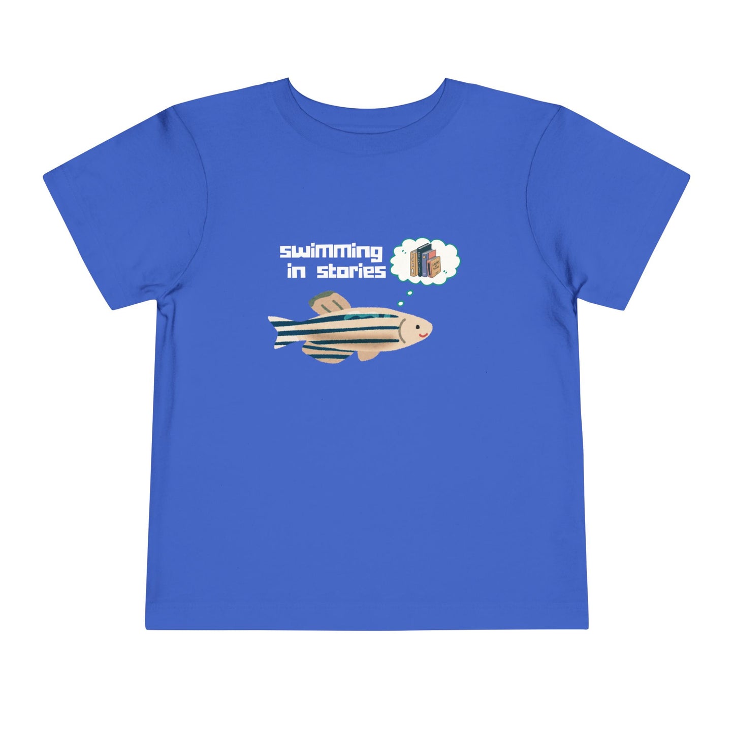 Blue t-shirt with a fish graphic, thought bubble picturing books, and text 'swimming in stories' 