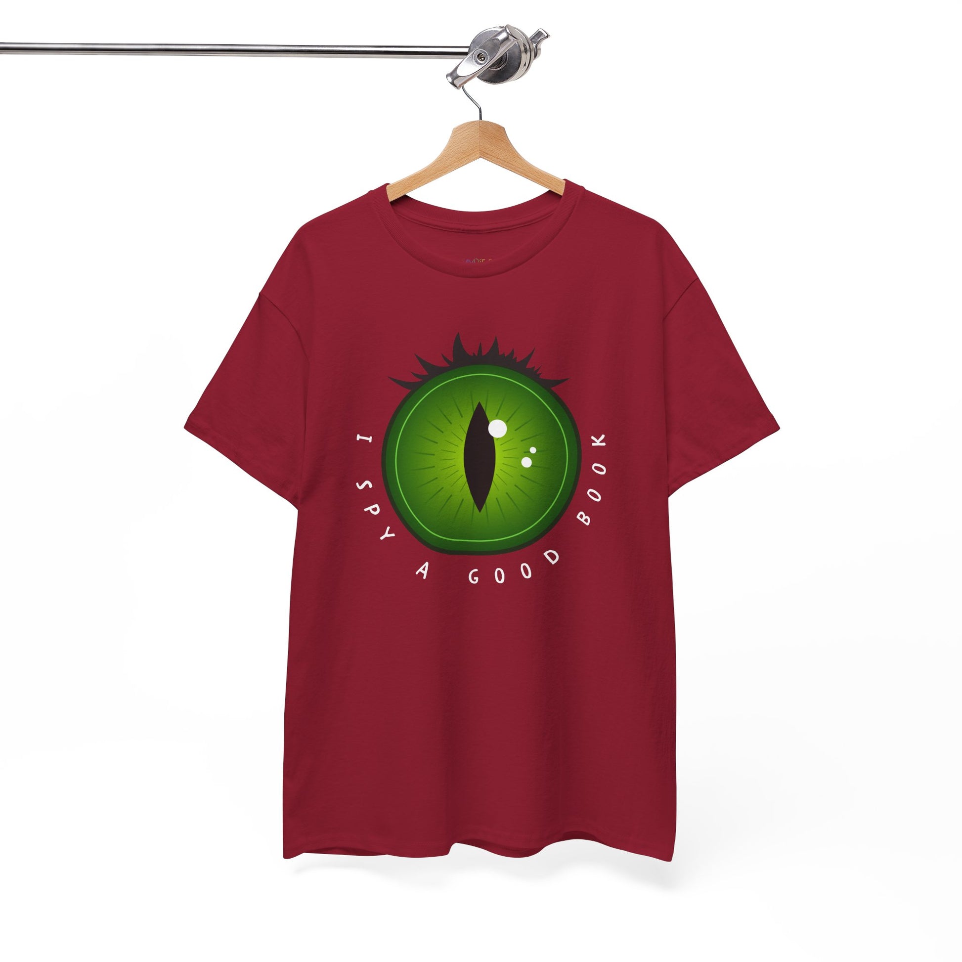 Red t-shirt with a green eye design and text 'I Spy A Good Book' on a hanger against a white background
