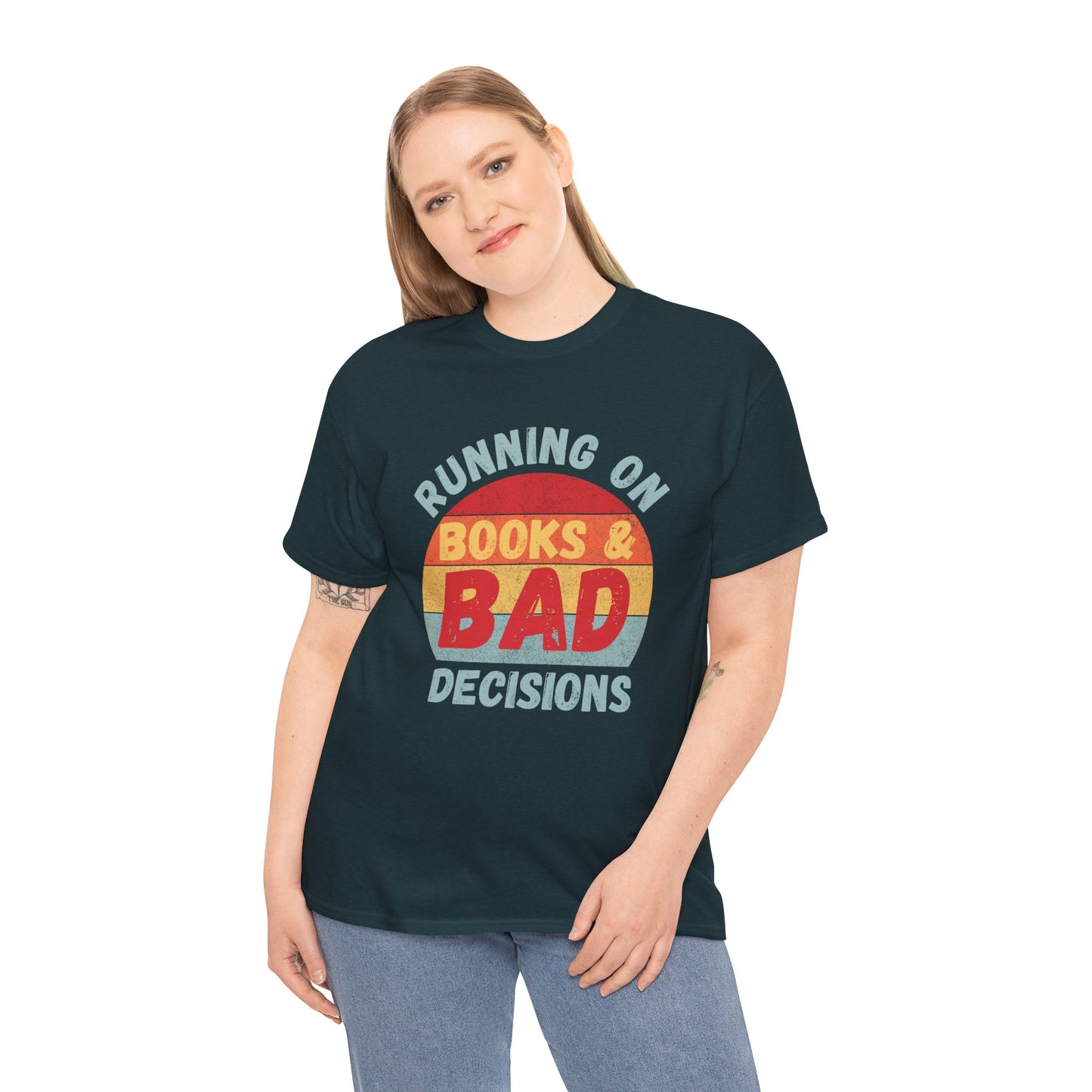 Woman wearing a dark (midnight) t-shirt with colorful retro striped sunset and text 'Running On Books & Bad Decisions' 