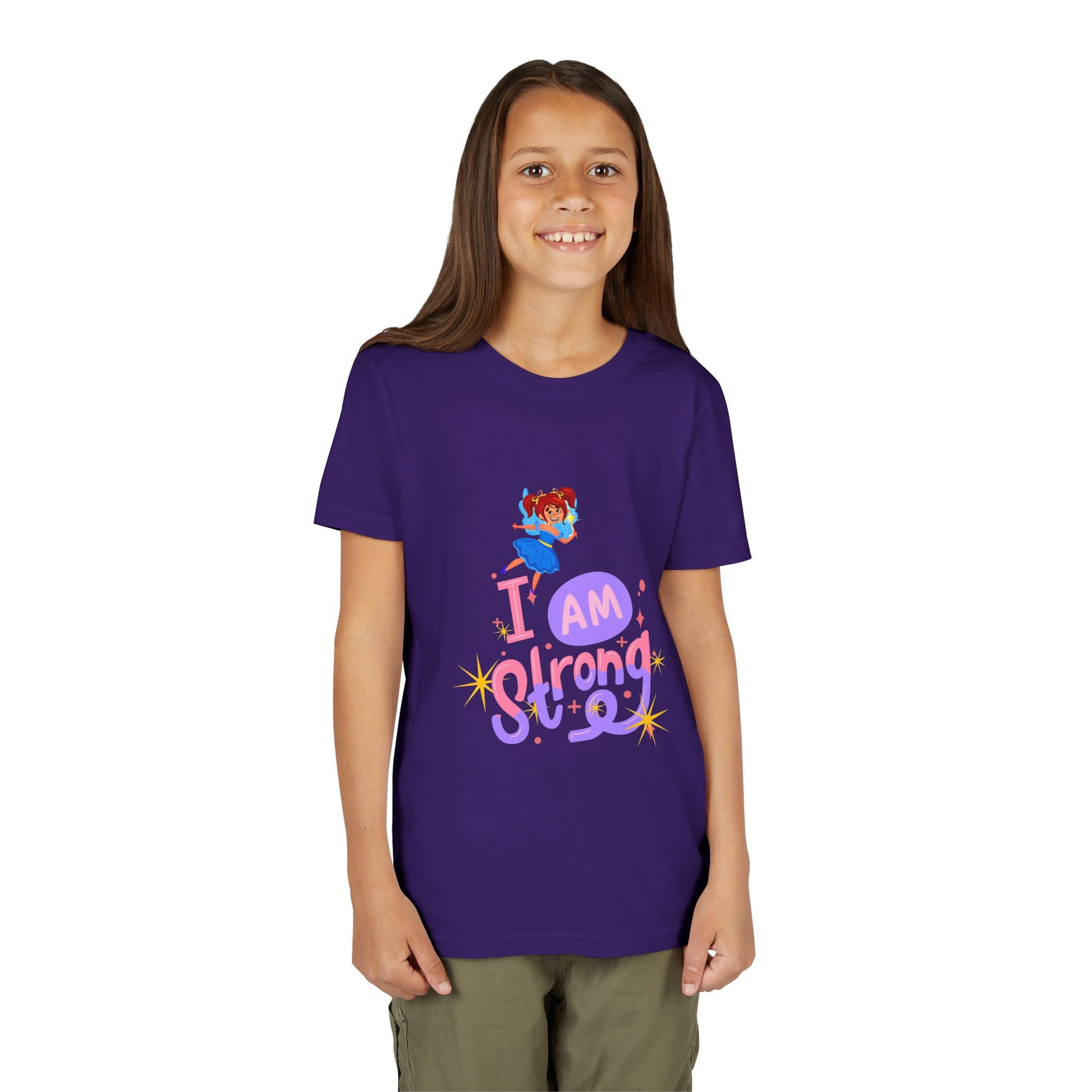 Girl wearing a purple t-shirt with a colorful fairy graphic and text 'I AM STRONG'
