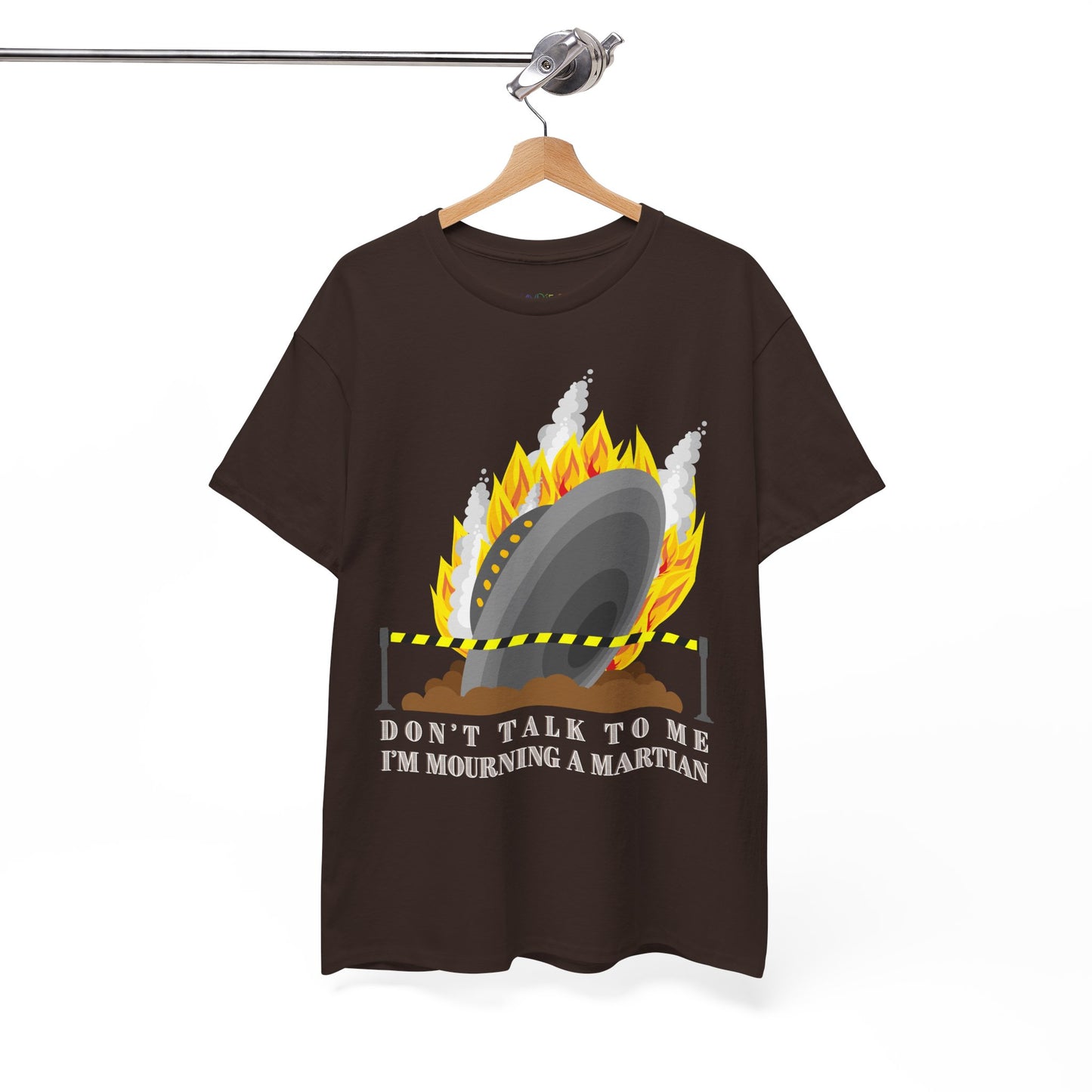 Brown t-shirt with a crashed spaceship blocked by caution tape and text 'Don't Talk To Me I'm Mourning A Martian' 